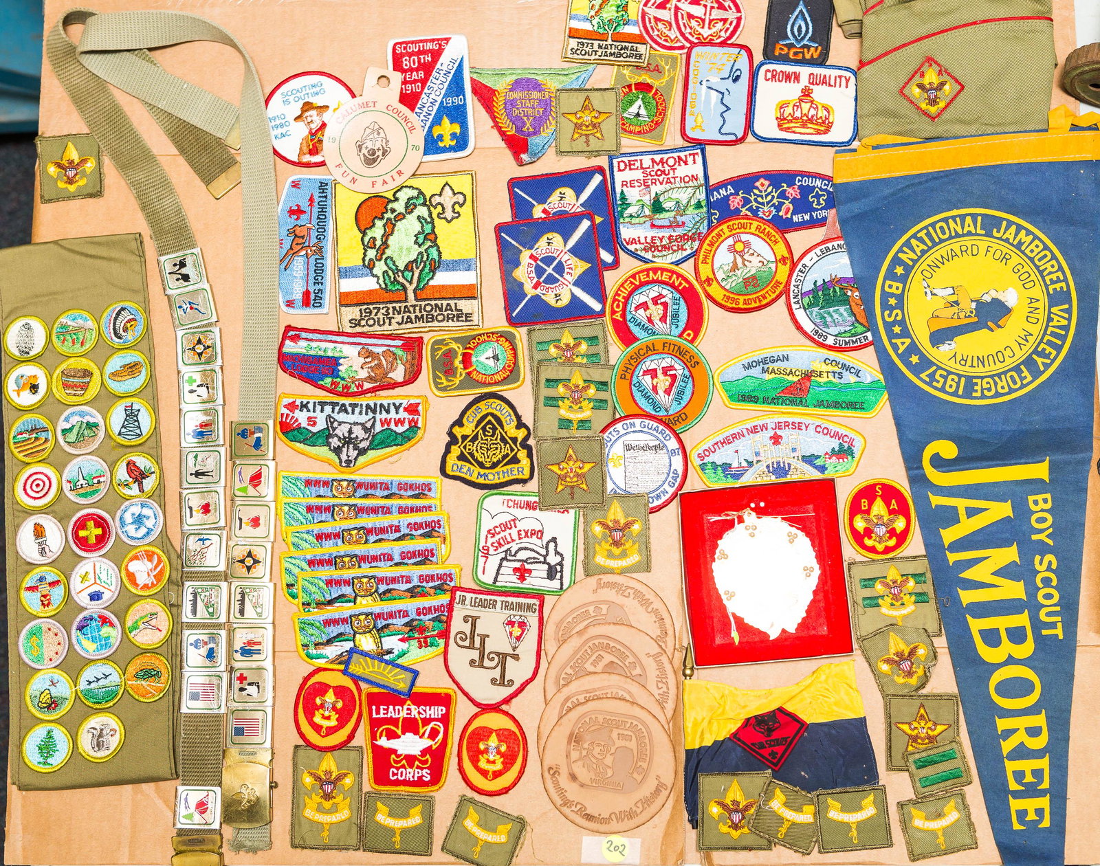 Vintage and Contemporary Boy Scout Collection: Lot includes a selection of merit patches, merit belt patches, camp patches, 1957 National Jamboree pennant, and many other Boy Scout related items.