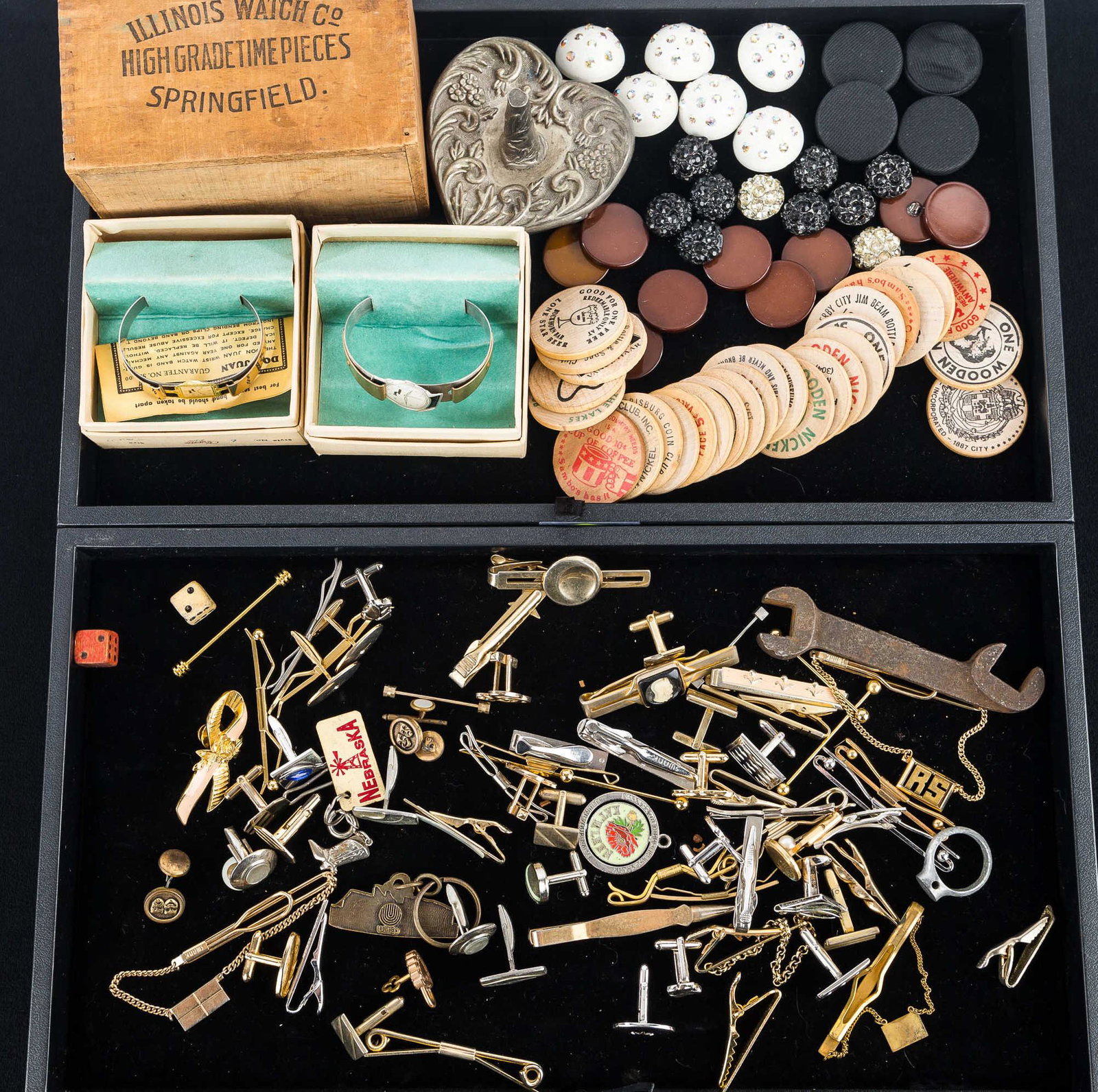 Men's Jewelry, Watch Related and Buttons: Lot includes a selection of cufflinks and tie tacks, various sets of buttons, wooden bar tokens, 2 size S watch bands, a ring holder and an Illinois wooden watch box.