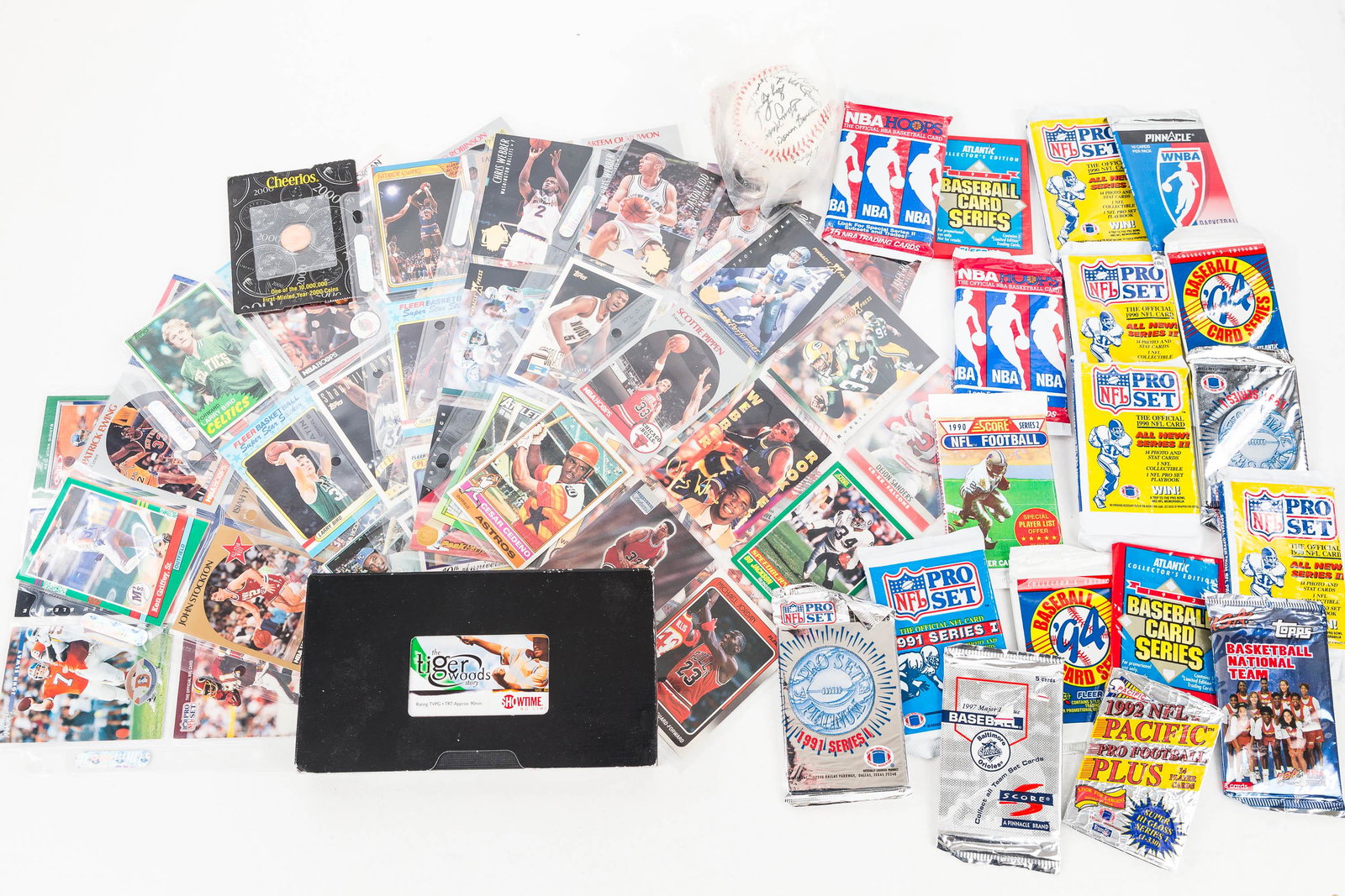 Larry Bird, Michael Jordan, Other Sports Cards: Lot includes 1982 Larry Bird card, 1989 and 2 1991 Michael Jordan cards, as well as various others. All are in protective packing. Lot also includes a collection of sports cards in original packs, an 