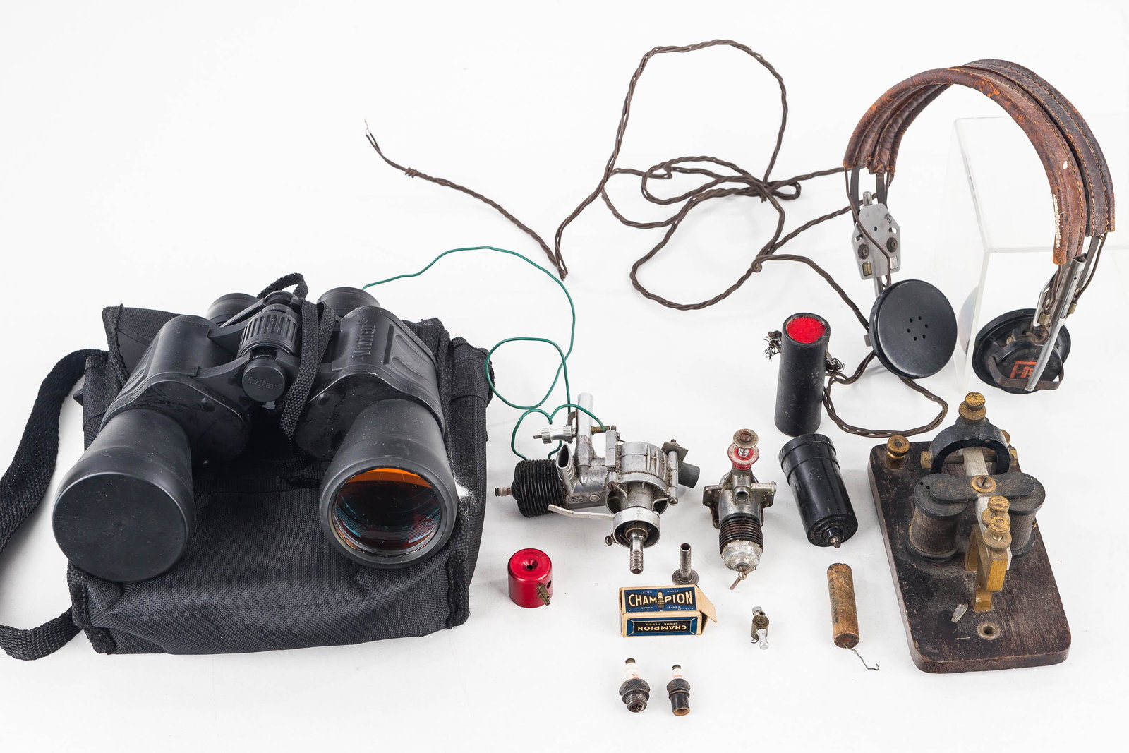 Cox Type Engines, Binoculars, and Related: Lot includes two Cox type engines (incomplete), a pair of Vivitar 7x30 binoculars with case, and a set of headphones with electronics.