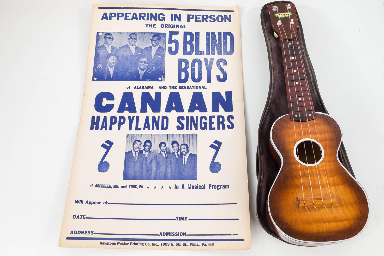 Harmony Ukulele and Five Blind Boys Poster: Lot includes vintage Harmony ukulele with celluloid finger board and original label (with bag) and a Five Blind Boys music poster with dog eared corner.