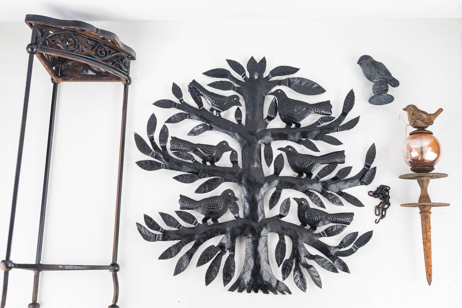 Cast and Tin Garden Grouping: Lot includes triangular plant stand (22.5"H), 2 cast birds (one with glass ball in center), and a tin bird tree (21"H).