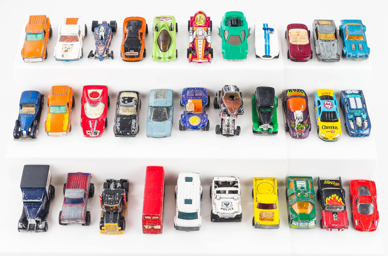 Matchbox, Hot Wheels, and Related Vehicles: Lot includes over 30 vehicles including Matchbox Super Fast, Hot Wheels, and related vehicles including the Bubble Gunner Hot Wheels, Matchbox Super Fast Chevy Van, and others. Surface conditions vary