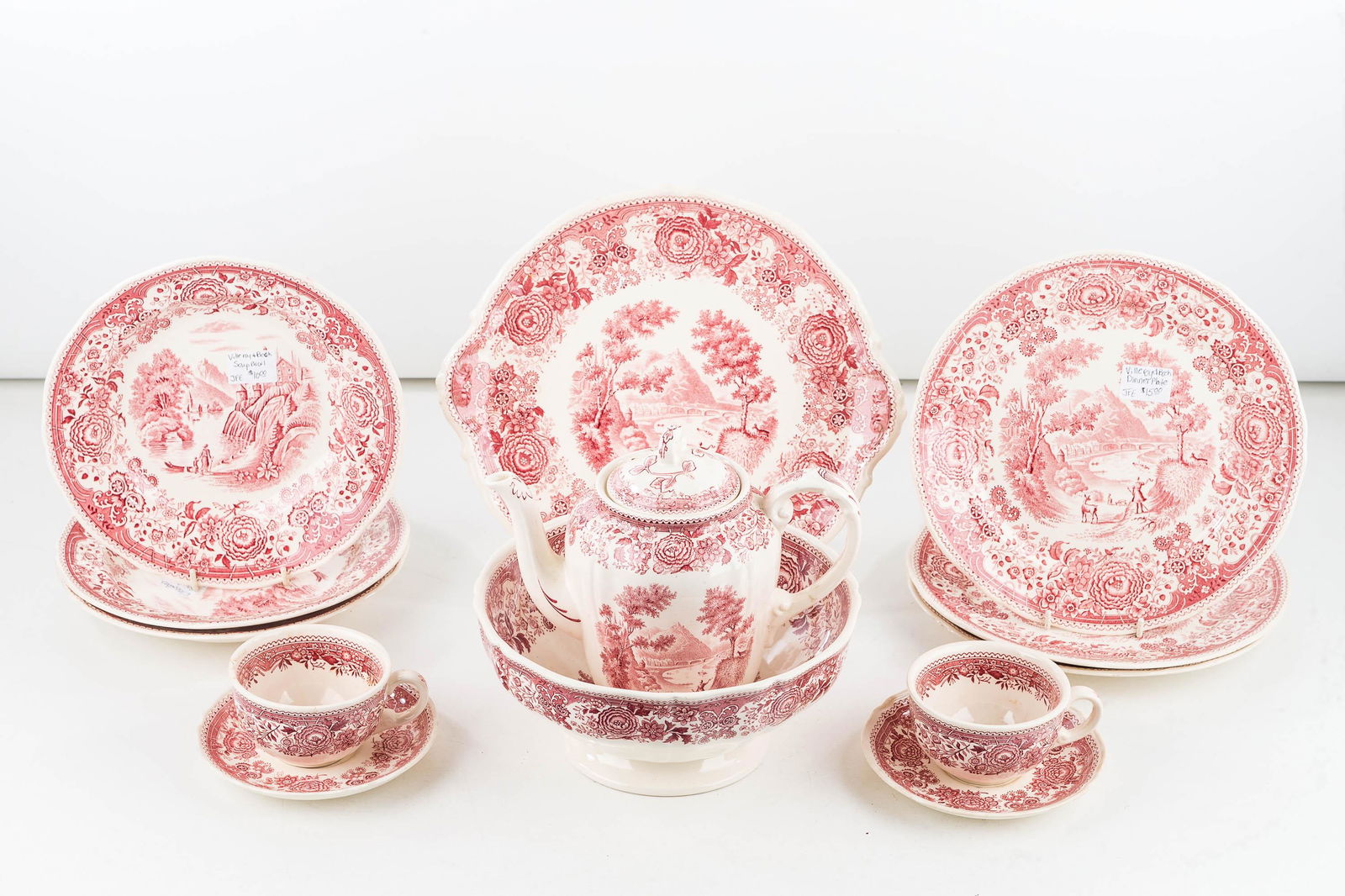 Villeroy and Bosh Burgenland Red Transfer Ware: Eleven items including a tea pot, round platter, soup plates, two cups and saucers and other pieces.