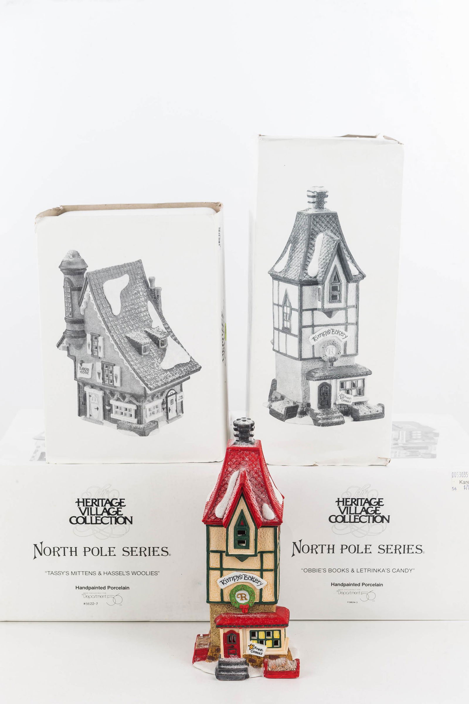 Department 56 Collection/North Pole Series: From the North Pole Series: Rimpy's Bakery, Elfin Snow Cone Works and two others. Four total pieces in original boxes