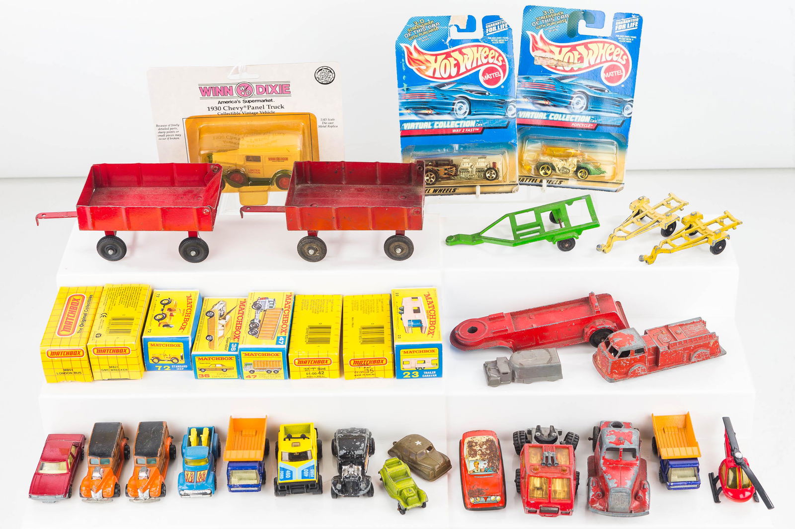 Matchbox and Related Vehicles: There are eight Lesney Matchbox in original package, Tootsie Toy fire truck, and related vehicles
