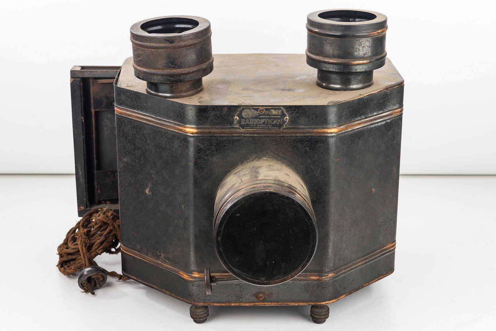 "Radiopticon" Vintage Magic Lantern: Radioptican Vintage Magic Lantern measures approx 10.5"h, model 441, produced by H.C. White Co, Vermont, items retains top and front lenses, original sliding tray, and electric cord (cord is frail)