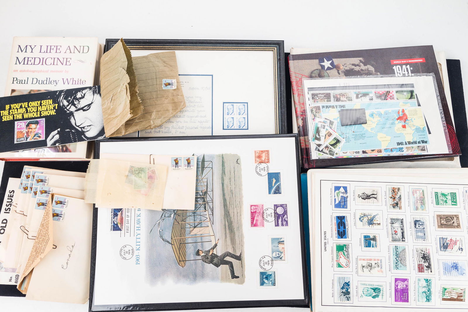 Patriotic Stamp Albums and Loose Stamps: The Harris Freedom Album United States approx 1/3 full with stamps from early-mid 20th C, unused WW2 1941 A World at War stamp book and stamps to go in it ($5.80 face value), Kitty Hawk to Mars stamp