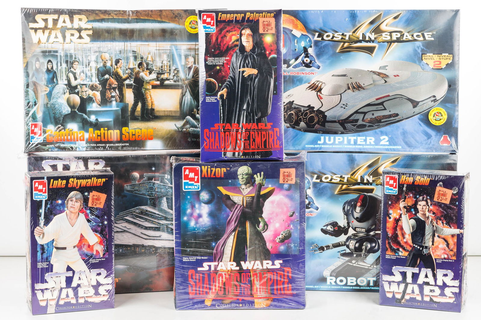 Star Wars & Lost in Space Model Kits: 2 Star Wars Destroyer by AMT model 8915 and The Cantina Action Scenemodel 8205, and Lost in Space model kits by AMT include the Jupiter 2 model 8459 and Robot model 8458. New old stock.