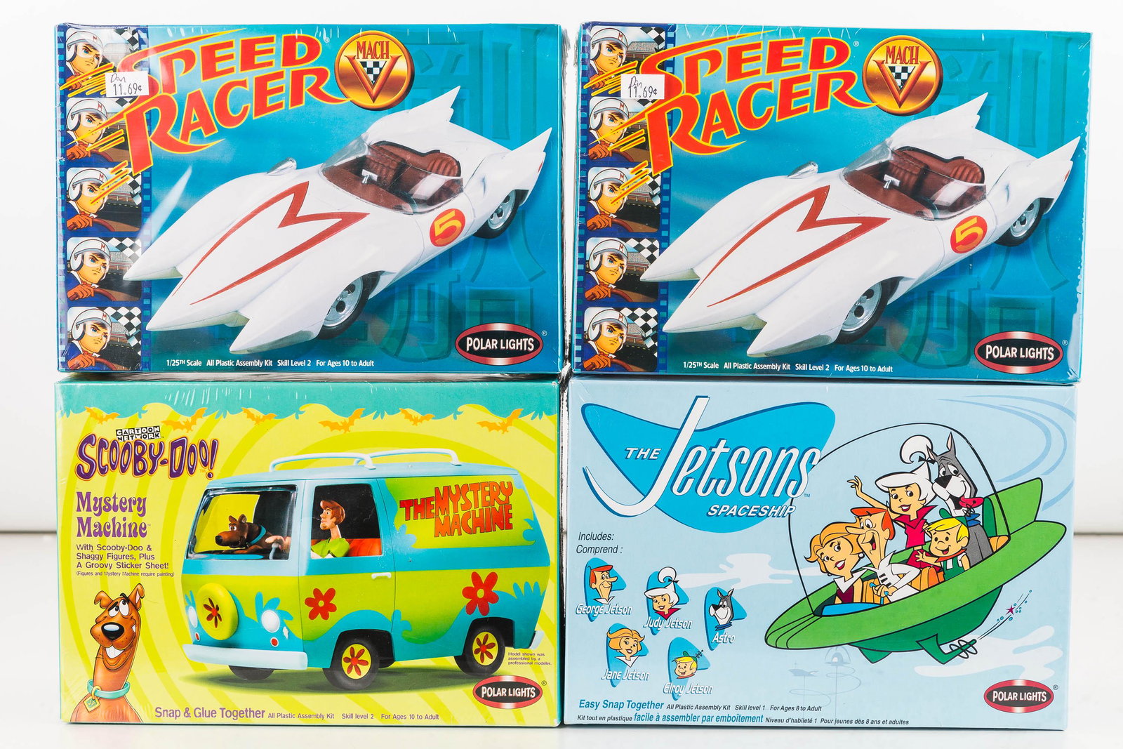 Polar Lights Vintage TV Show Model Kits (4): Two Speed Racer Mach 5 race car plastic assembly kits model#6700 c2000 and The Jetson's Spaceship includes characters c2001 Playing Mantis, and The Scooby Doo Van / Mystery Machine model# 6808.