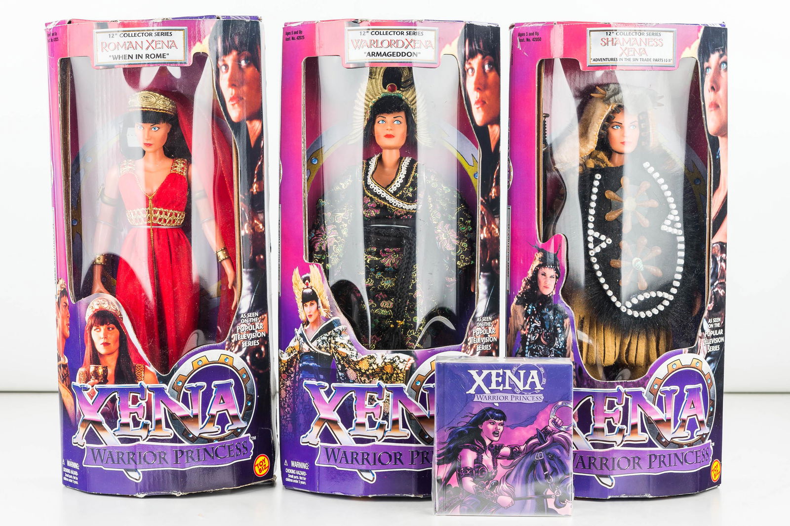 Xena Warrior Princess 12" Action Figures (3): Three 12" tall action figures by Toy Biz including Roman Xena, Shamaness Xena, Warlord Xena (item#42026, 42029, 42051) plus a small book by Mighty Chronicles on Xena, ISBN 0-8118-2207-9.