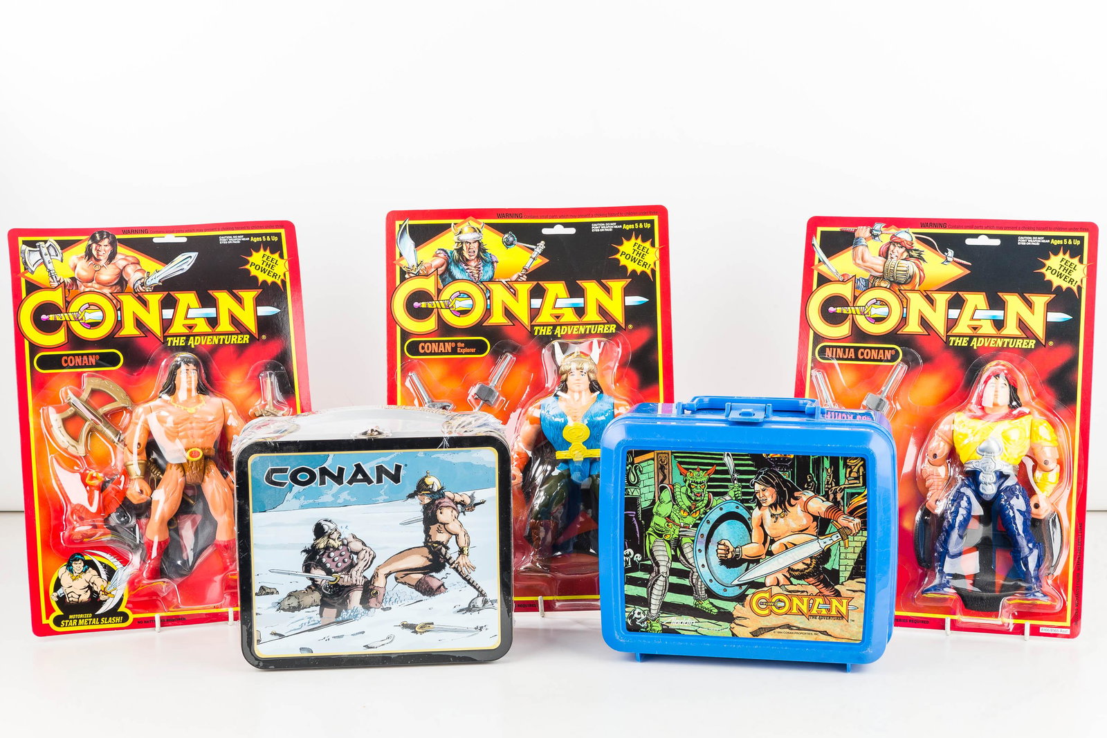 Conan The Adventurer 7" Action Figures/2 Lunch Box: One lunch box by Dark Horse Deluxe and one blue plastic lunchbox by Aladdin (writing on bottom but unused) and 3 motorized Conan figures Conan, Conan the Explorer and Ninja Conan.