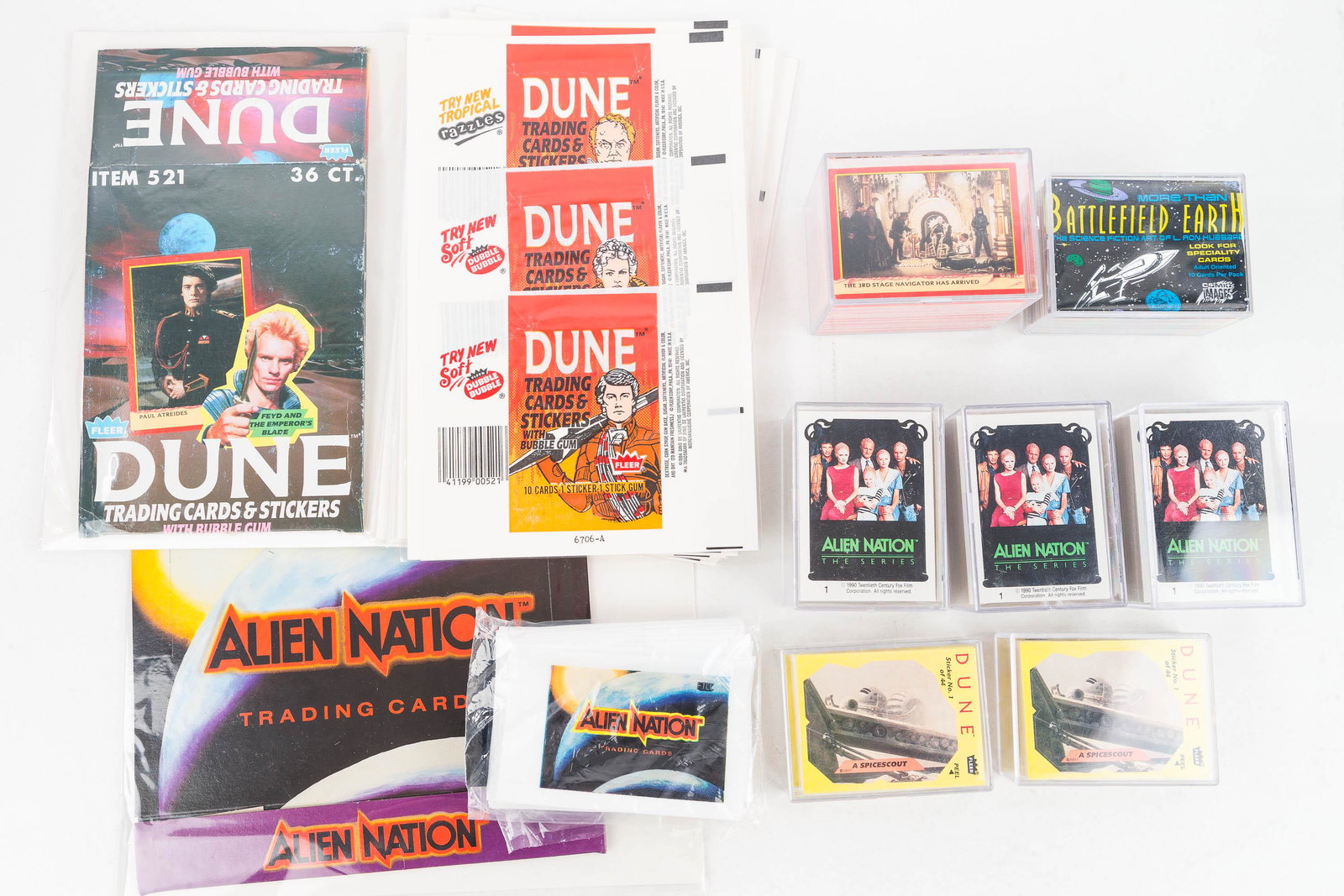 Collector Cards / Dune, Alien Nation: Seven sets of cards; 3 are Dune, one Battlefield Earth, and 3 alien nation. Also an alien Nation box and card sleeves; 8 Dune card wrappers and a Dune box. Card sets not checked for completeness.
