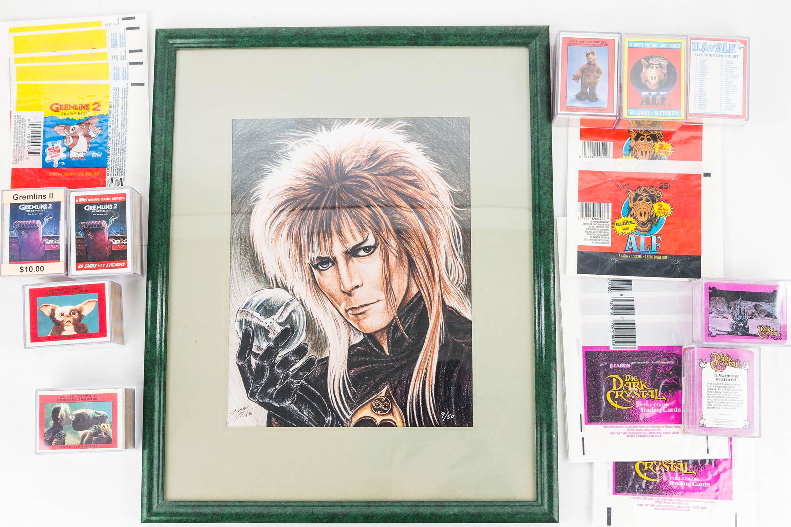 Collector Cards / Kids Fantasy: Two sets of The Dark Crystal and wrappers, 3 sets of Gremlins/gremlins 2 and wrappers; an E.T. set c1982; and 3 Alf sets approx c1987; and a framed print of David Bowie from The Labyrinth c1986. Card