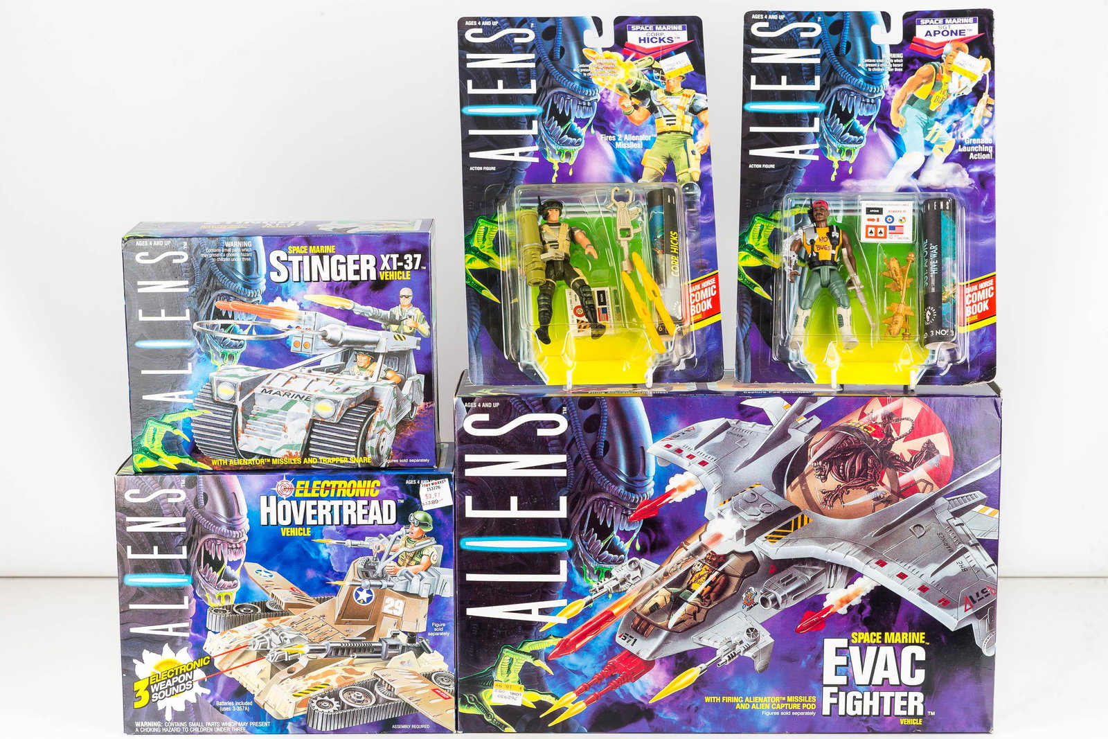 Aliens Evac Fighter and Related: Five total pieces including Fighter dated 1992 (box is taped), 2 Aliens Military vehicles dated 1992, and 2 action figure sets also dated 1992. NIP