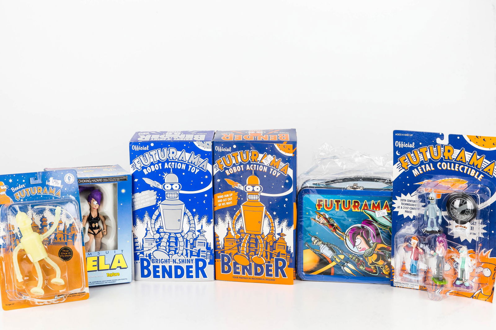 Simpsons Figures and Lunch Box: Six total pieces including lunch box dated 2000, 2 bender robots dated 2000 and 2001, glow in the dark bender, and related items. All NIP and lunch box in bag.