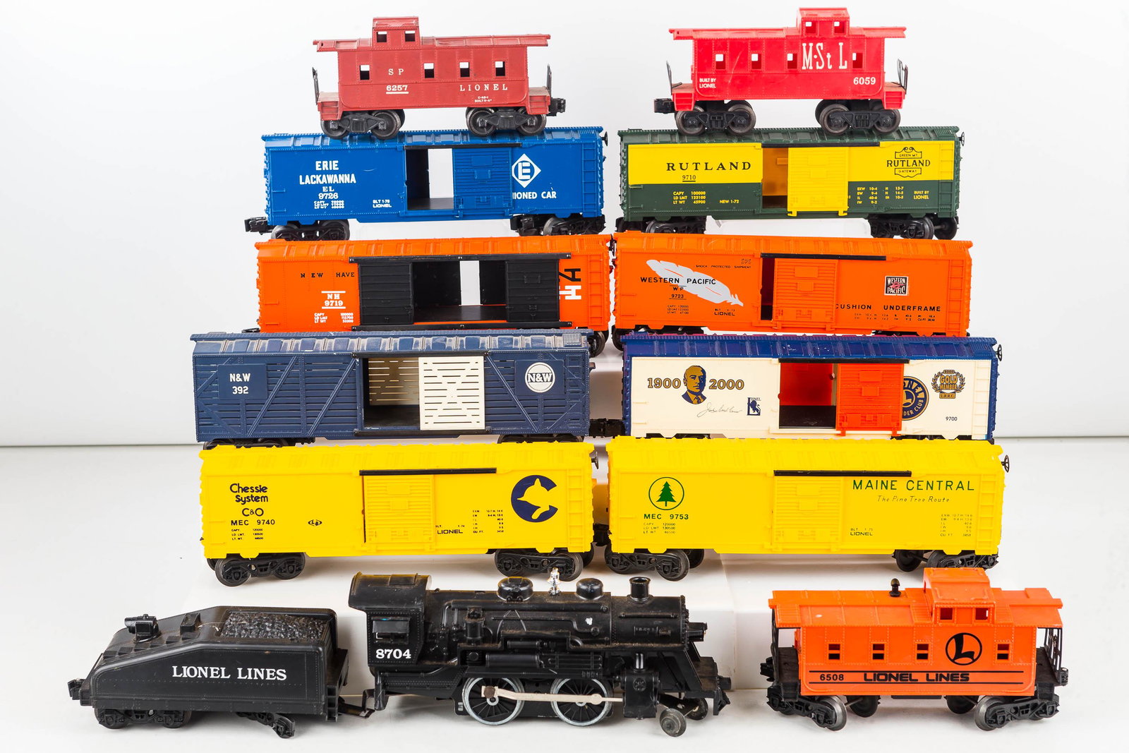 Lionel "O" Scale Train With Cars: Including Lionel engine #8704 with tender and a variety of train cars, including 100th year car.
