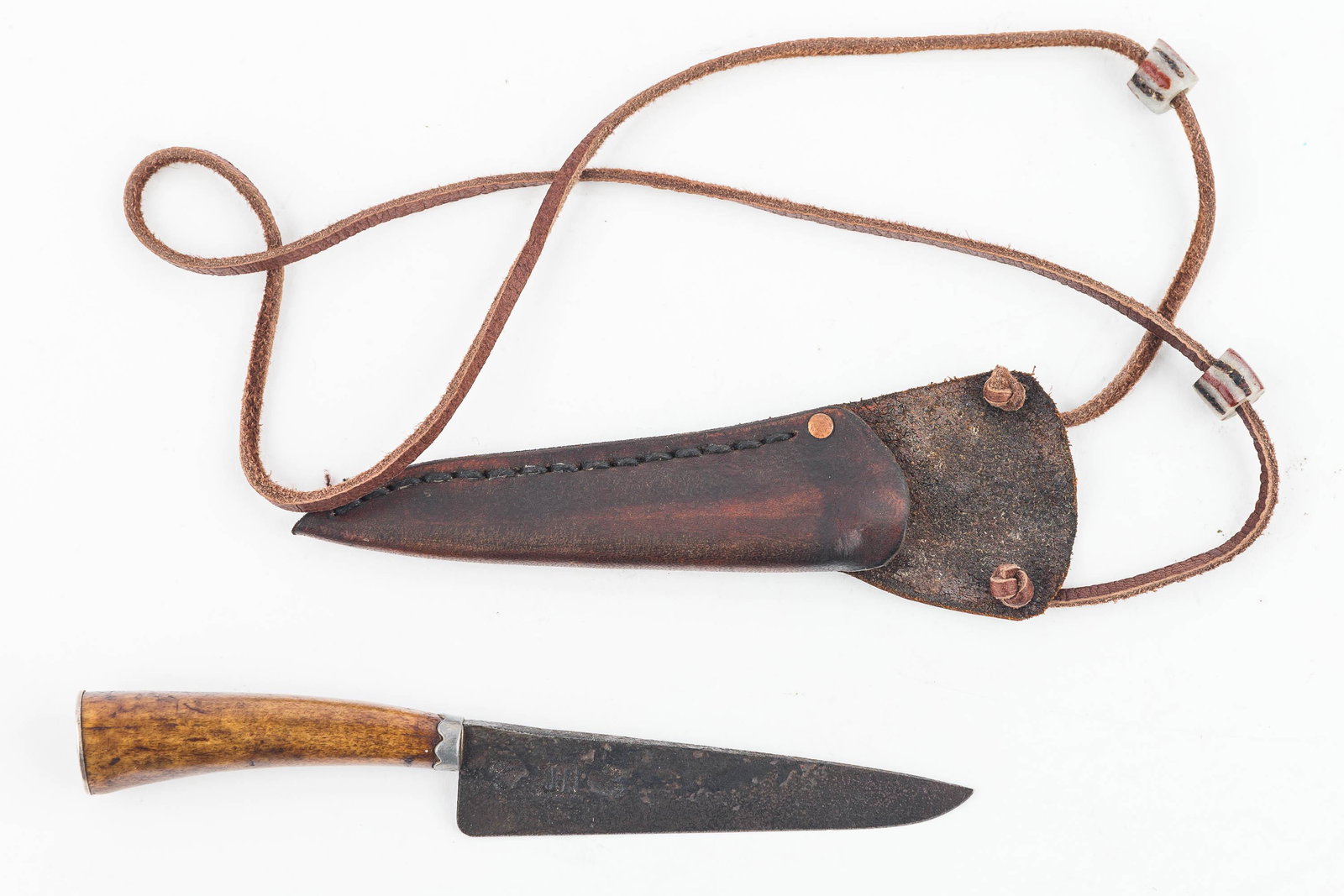 18th C Long Rifle Patch Knife: Hand forged blade with 3 impressed maker marks, a peened tang, with original butt cap. Sharp blade. Comes with later replica sheath and cord. Measures approx 5".