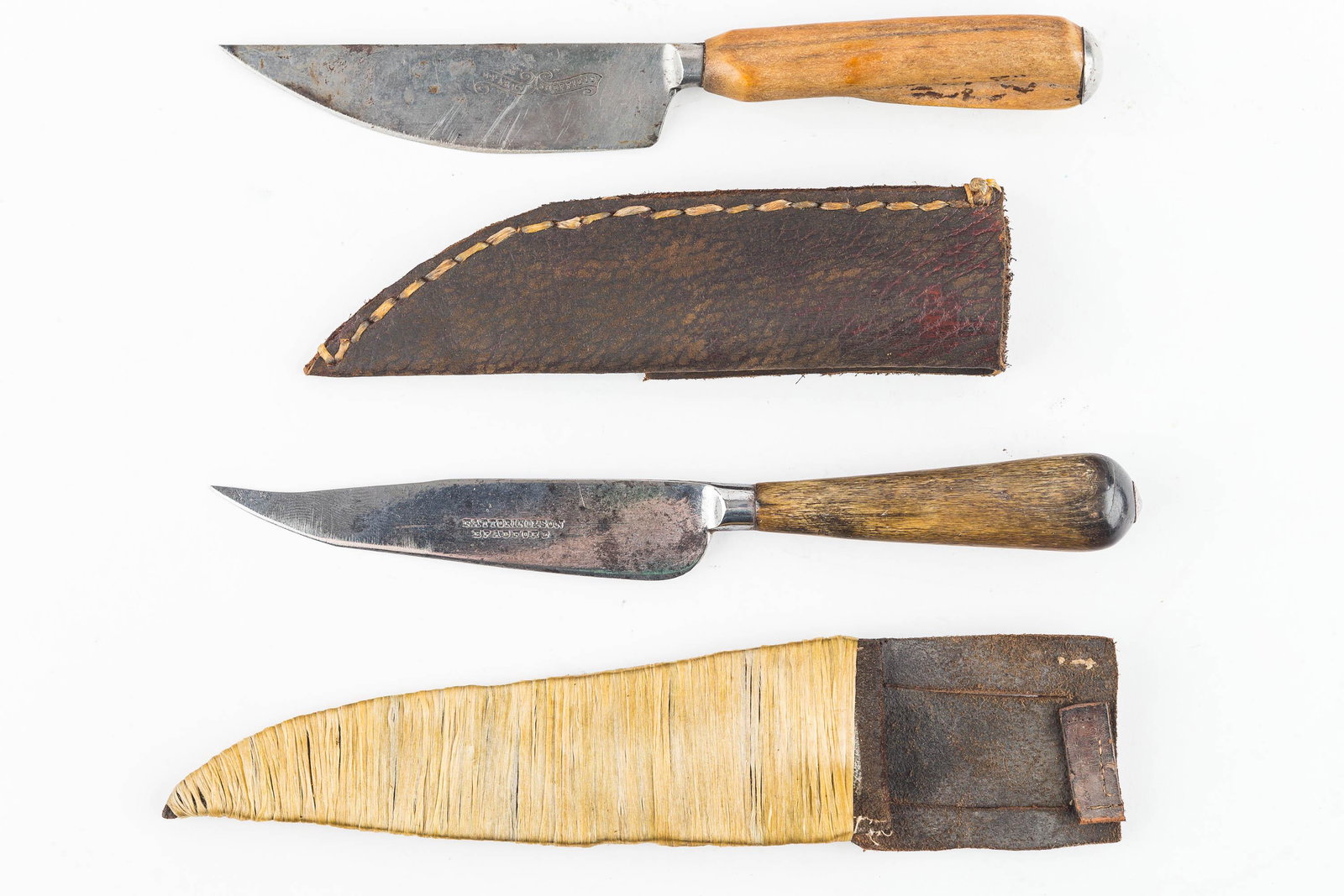 Long Rifle Patch Knives (2): Larger of the two has peen tang with original butt cap, hardwood handle, and steel blade marked FATTORINI and Son, Bradford. Larger measures approx 8" L.. The second measures 7 1/2" L, hard wood handl