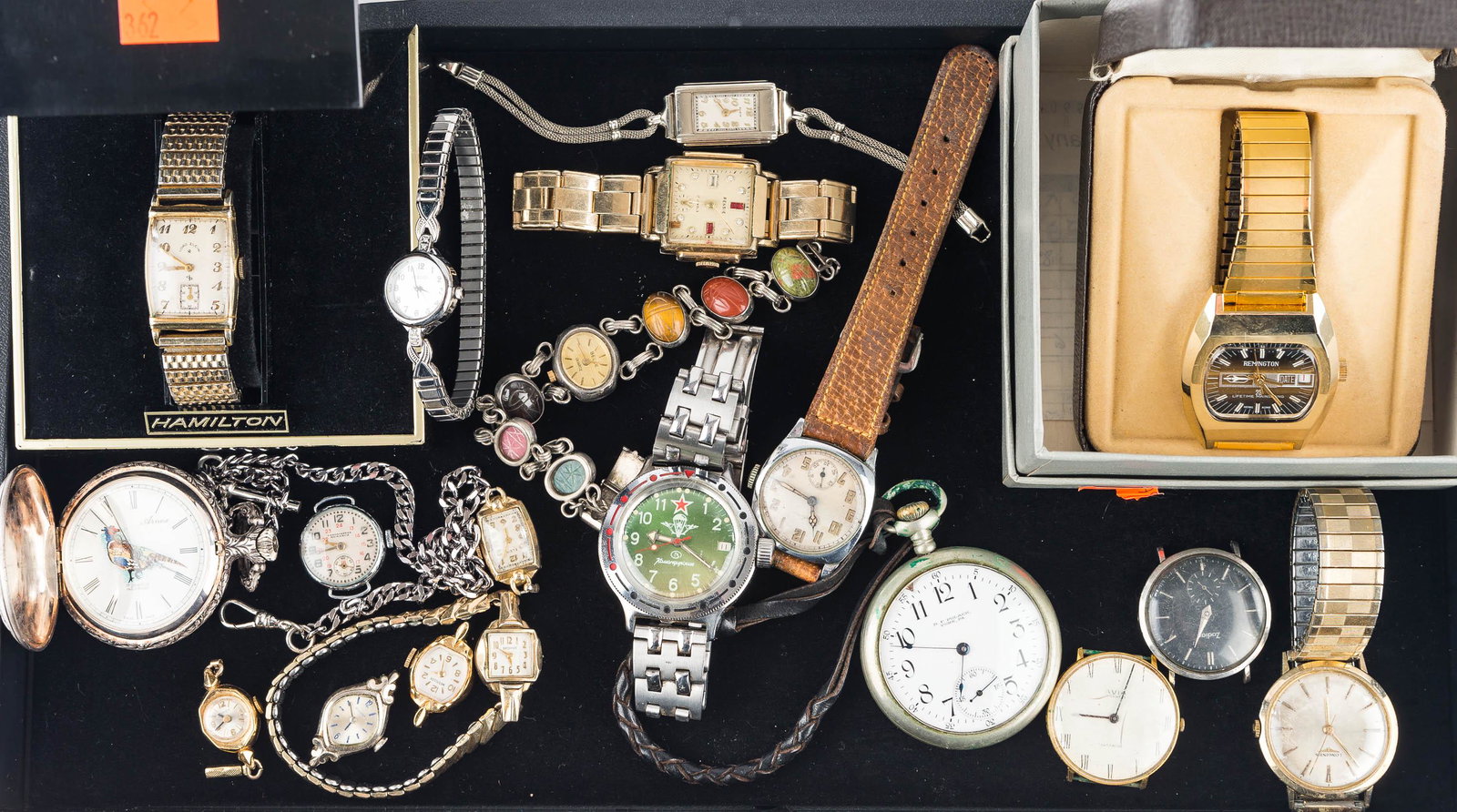 Collection of Wrist and Pocket Watches: Men's watches include a Lord Elgin, a gold tone Remington 23 with day, a Russian watch with green face, and others. Pocket watches include a RF Polack York, PA, an Arnex 17 jewel Incabloc marked Swiss