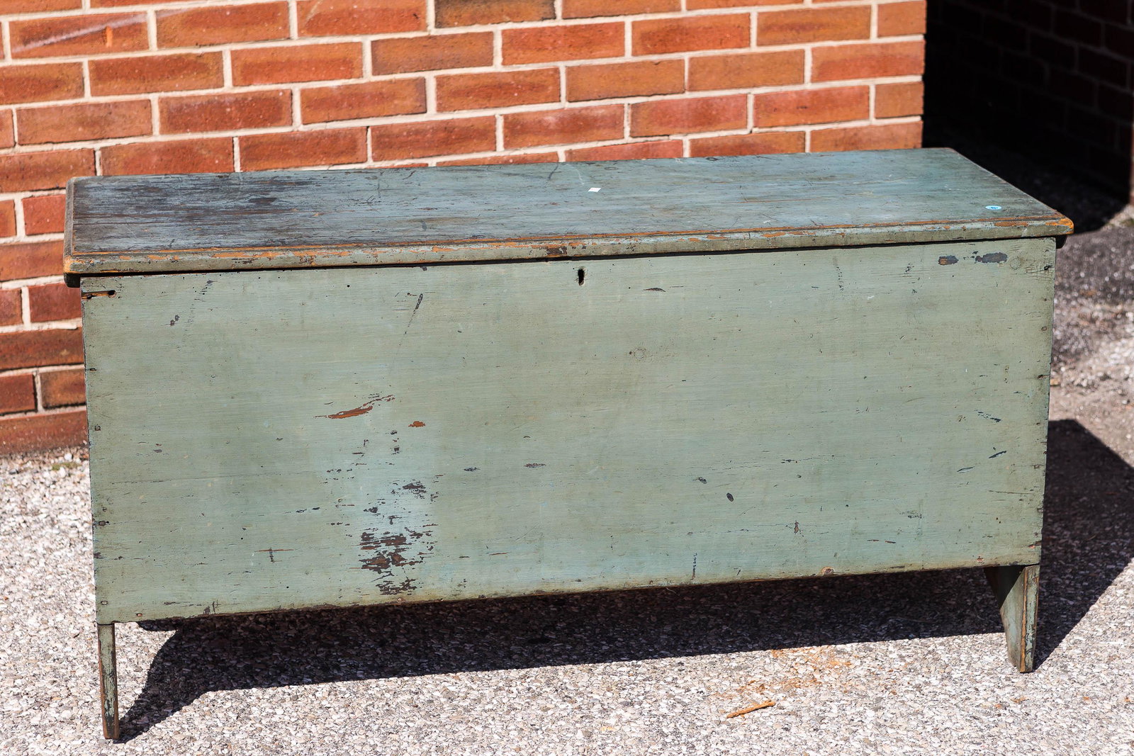 19th C New England Blanket Chest: Six board construction, painted green with nice surface, eye hook hinges, whale's tale carved ends, breadboard top, missing lock and interior till.