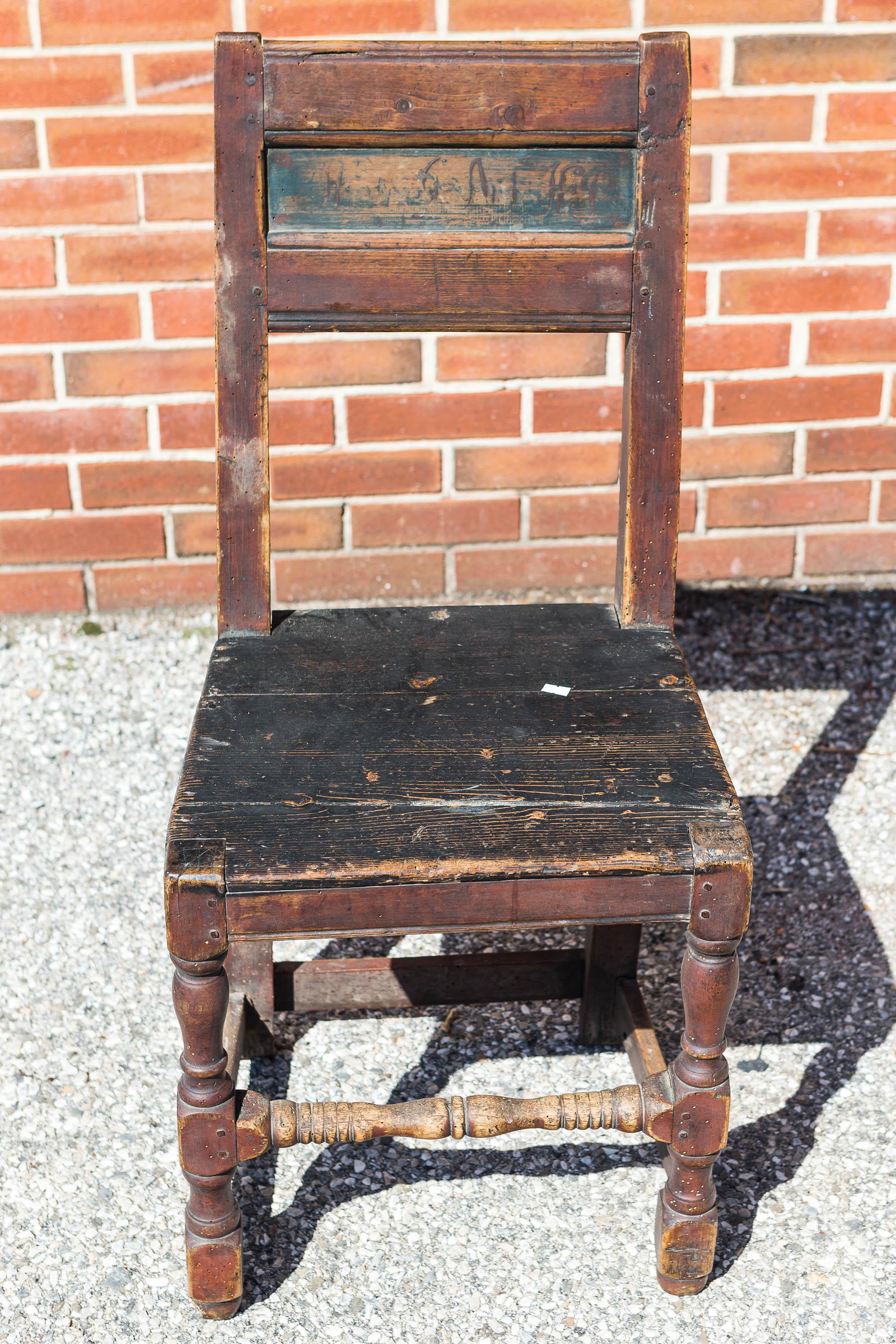 18th/19th C Pilgim Style Chair, Signed: Wooden peg construction with turned front legs, stretcher base and plank seat. Painted signature faded and age related wear.