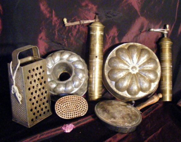 Lot of Metalware: Lot of Metal Ware including Two Grinders, Two Molds, Two Graters and a Silver Plated Cheese Dish.
