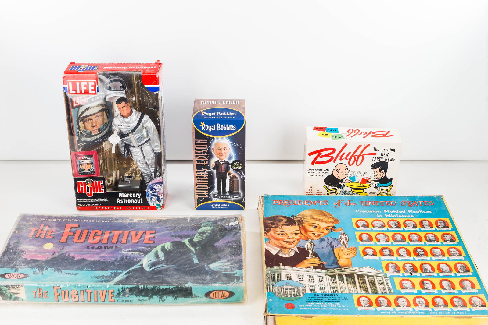 Toys and Games inclu Presidential Replicas: Toys of various ages including a paintable molded presidential replica set (latest president is Eisenhower); "The Fugitive" game by Ideal; "Bluff" party game; an astronaut GI Joe; and a Thomas Edison