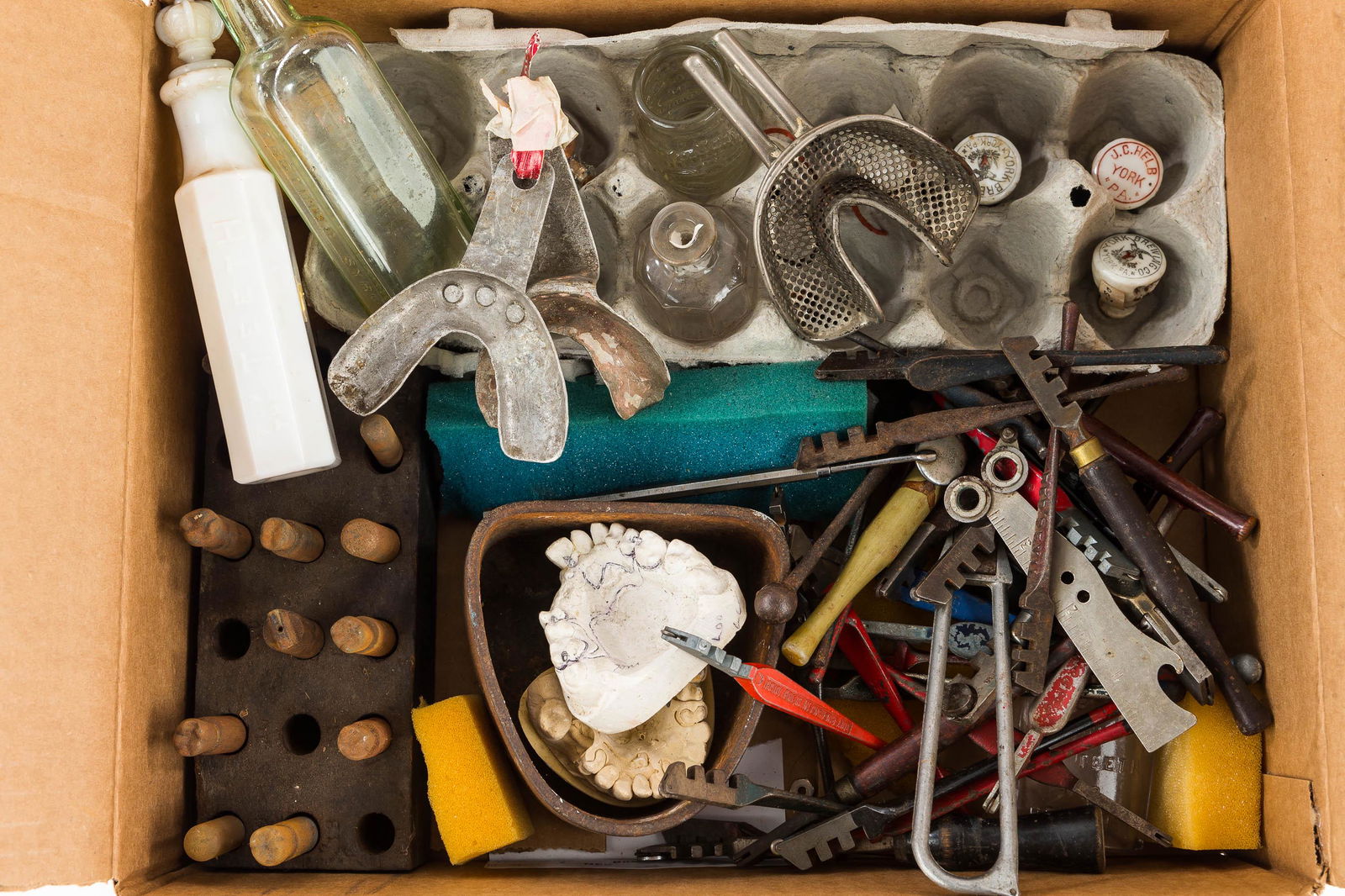 Vintage Dental and Advertising Items: Including molds of teeth, metal bitedowns, Sanitol bottle with glass stopper; "Teething Syrup"; "Teaberry Tooth & Breath Refresher" bottle; miniature Jim Beam barrel; metal Hires Root Beer stopper; an