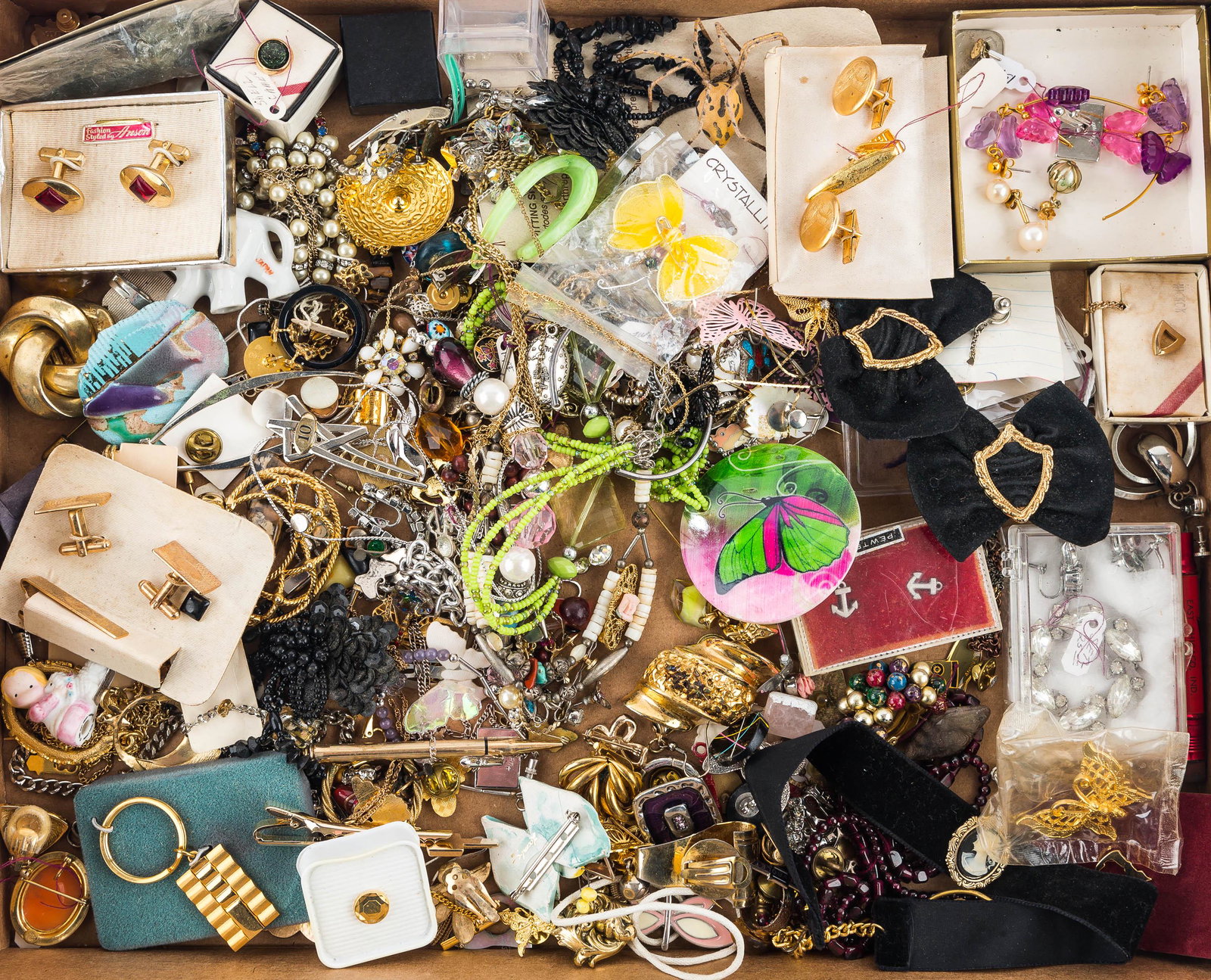 Costume Jewelry Grouping: Including butterfly jewelry, sweater pen, necklaces, brooches and related jewelry.