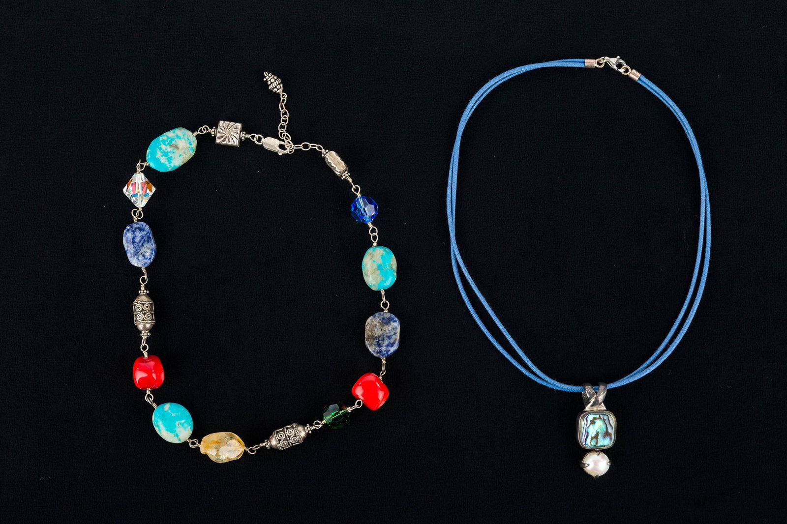 Sterling and Mineral Jewelry: This is a sterling and abalone pendant on cloth necklace and a sterling and polished mineral necklace.