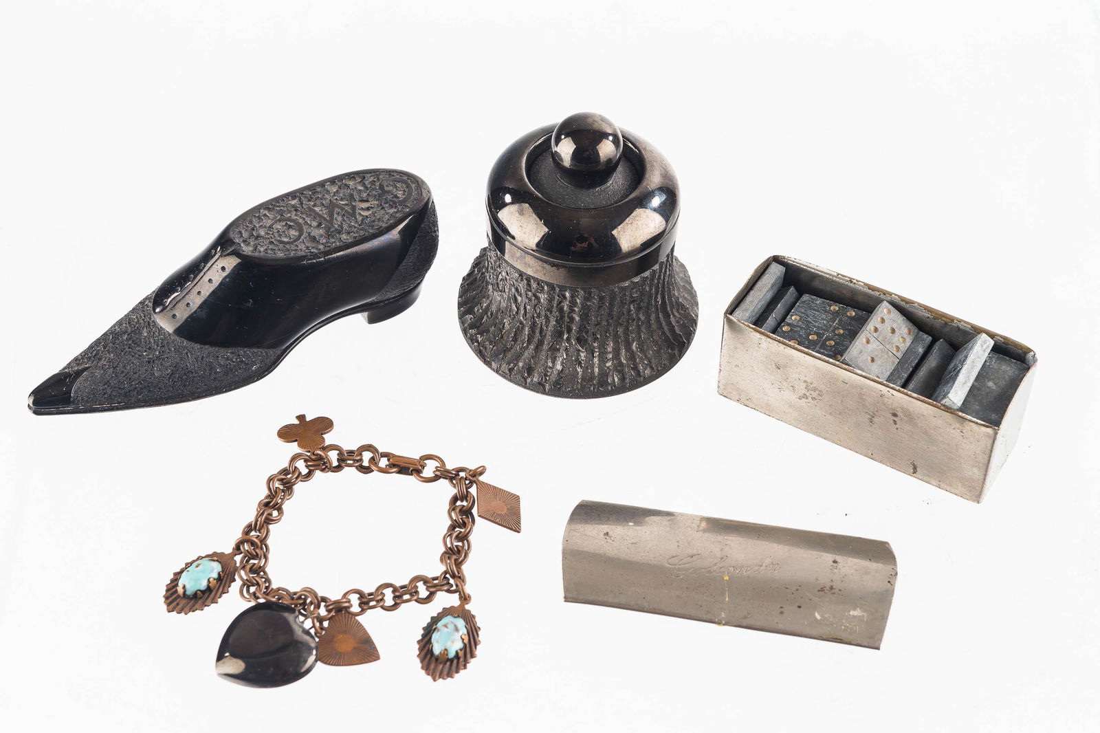 Coal Art Grouping: Including a charm bracelet with coal and turquoise charms, an advertising shoe, a coal inkwell, and a set of Golconda stone or coal dice.
