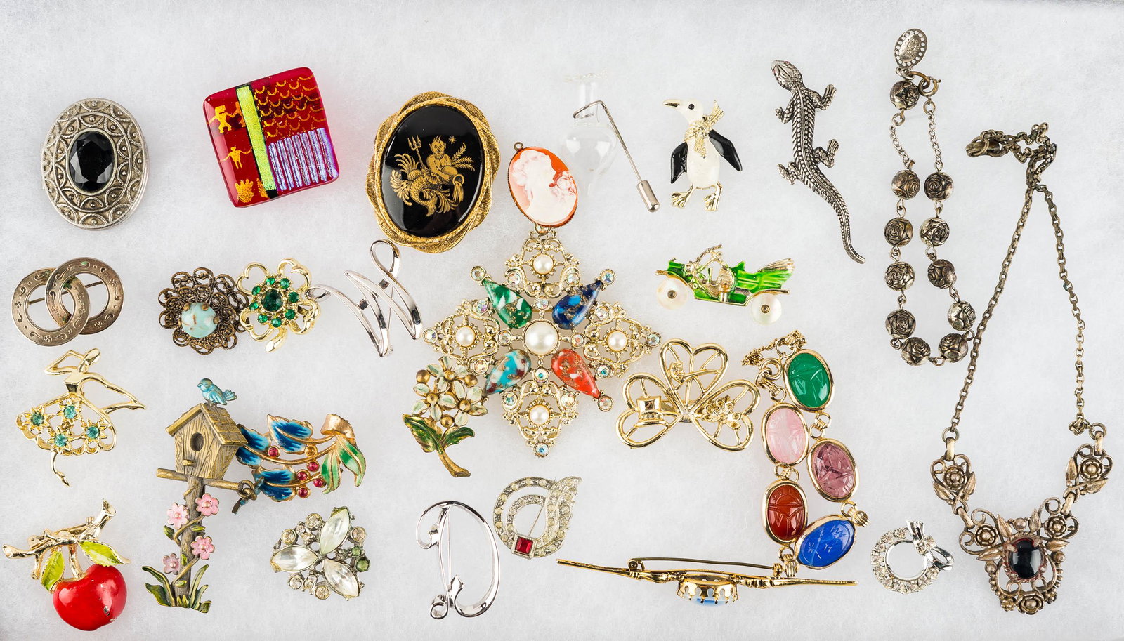Figural & Other Costume Jewelry: Collection includes animal pins, an apple pin, a scarab bracelet, a linear Austrian pin with faux opal, and enamel and other jewelry.