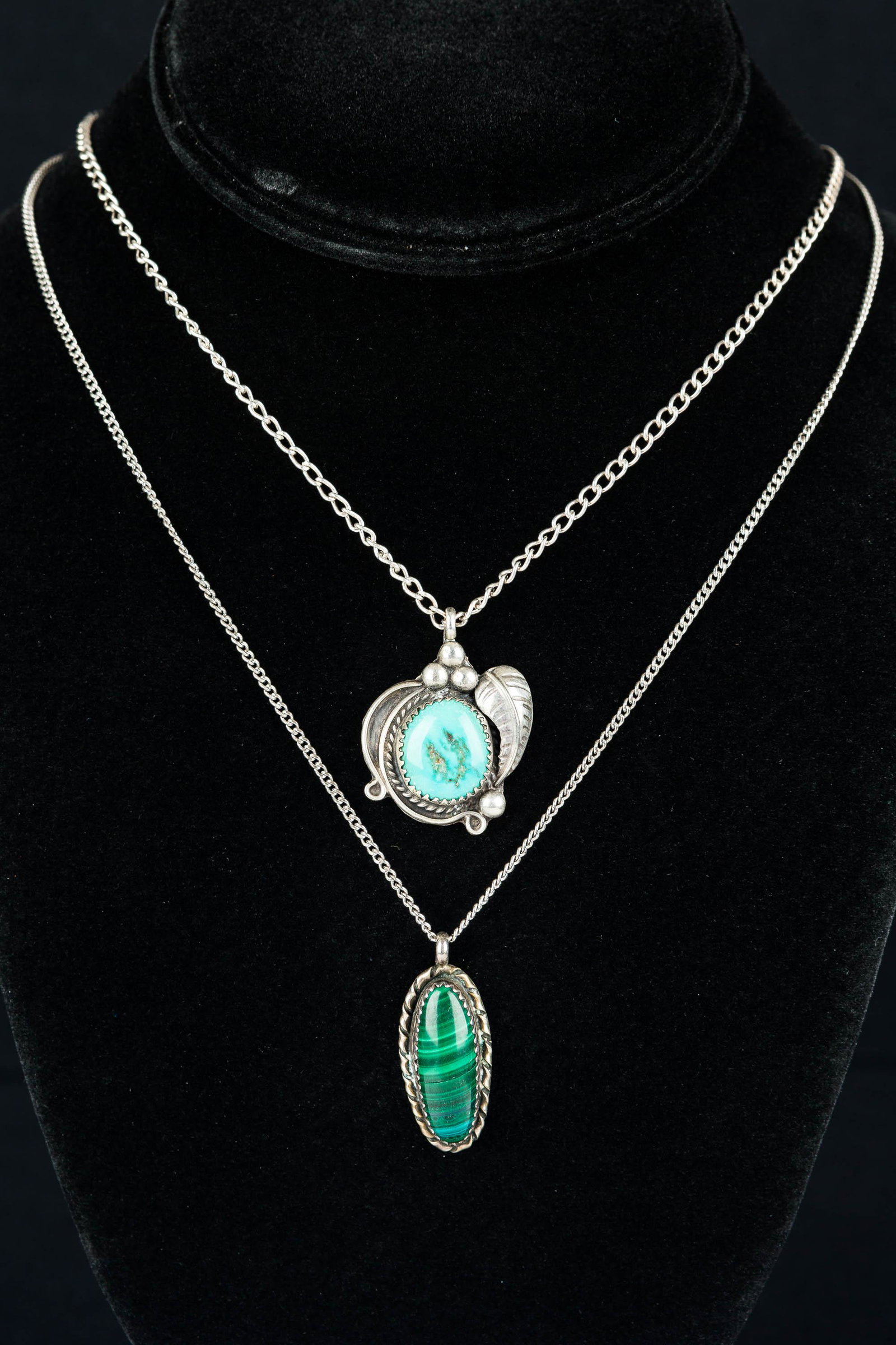 Native American Sterling Silver Necklaces: Vintage necklace with robin's egg blue turquoise with leaf motif; and large, oval-shaped malachite necklace.