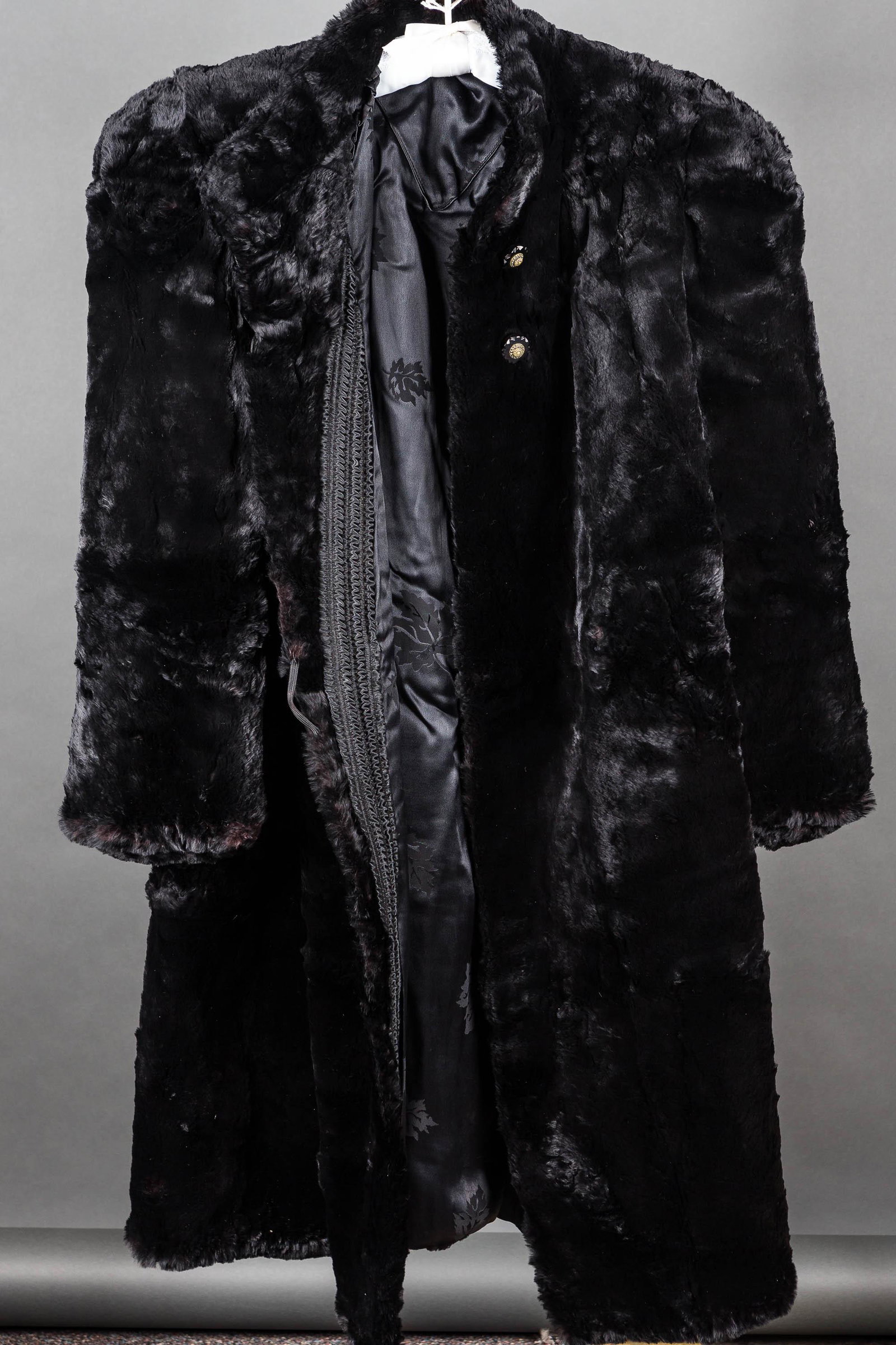 Vintage 1940s Seal Coat with the Shoulders: Long, black, seal fur coat, measuring approx. 41" collar to hem and 16" shoulder seam to seam, shoulder pad goes 3" into sleeve / heavily padded shoulder construction. It features loop and button (One