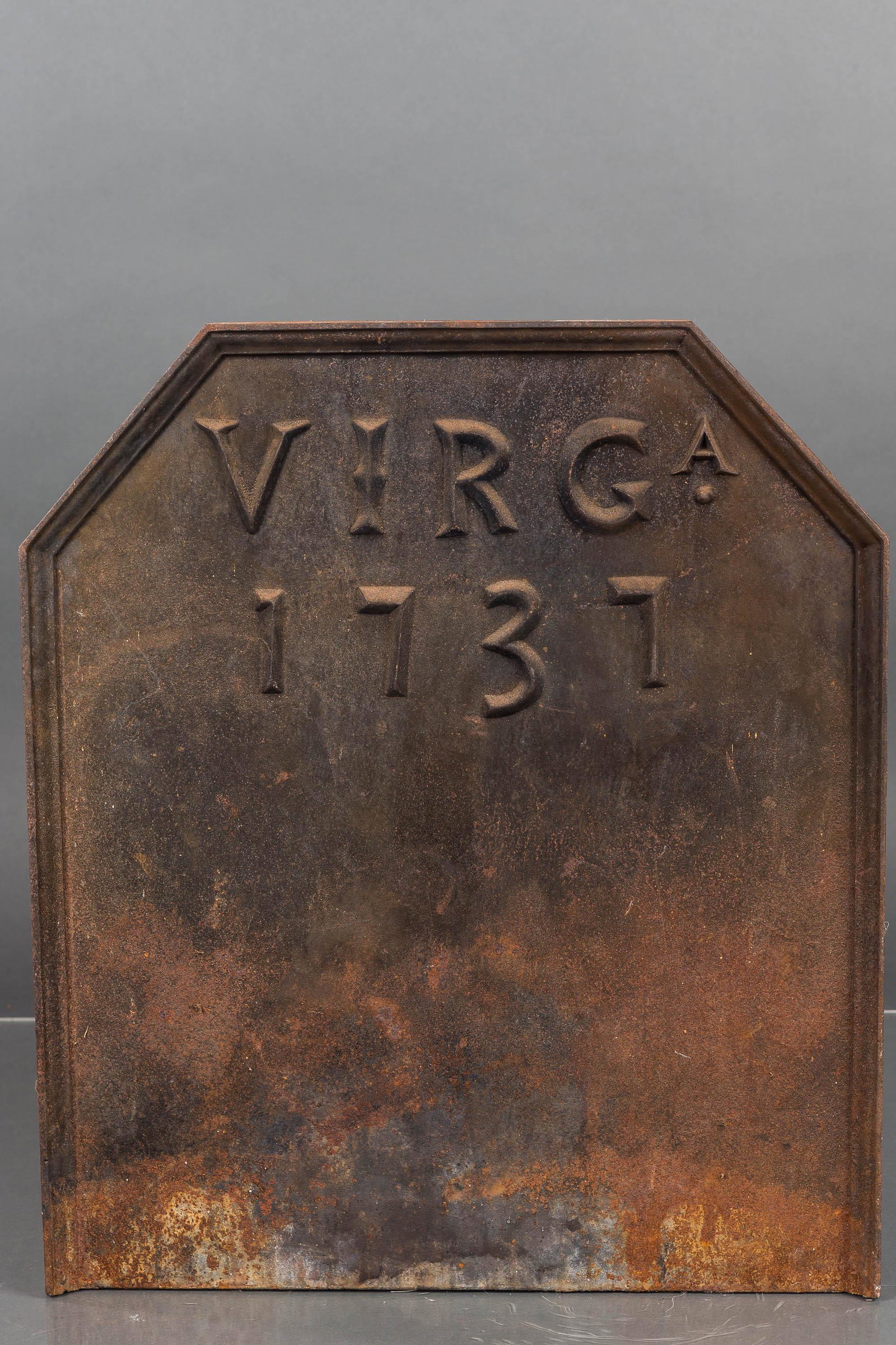 Cast Iron Fireplace Back: This set is a reproduction of a 1737 fireplace back. Item is heavy and functional, measuring approx. 24" H x 21" W.