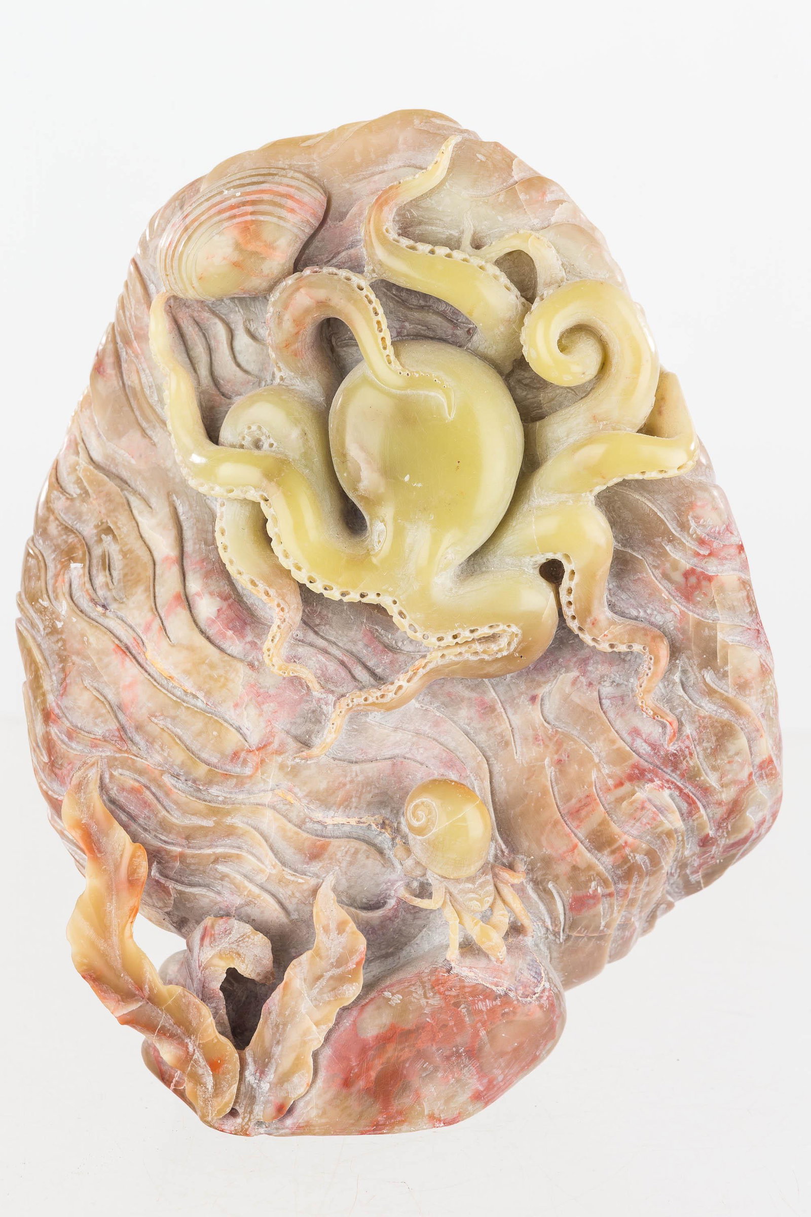 Large Carved Jade Octopus and Hermit Crab: Carved from a single piece of green and red jade, this piece depicts an octopus, a hermit crab, and a clam shell. Item comes on a wooden base and measures approx. 8" H not including base.