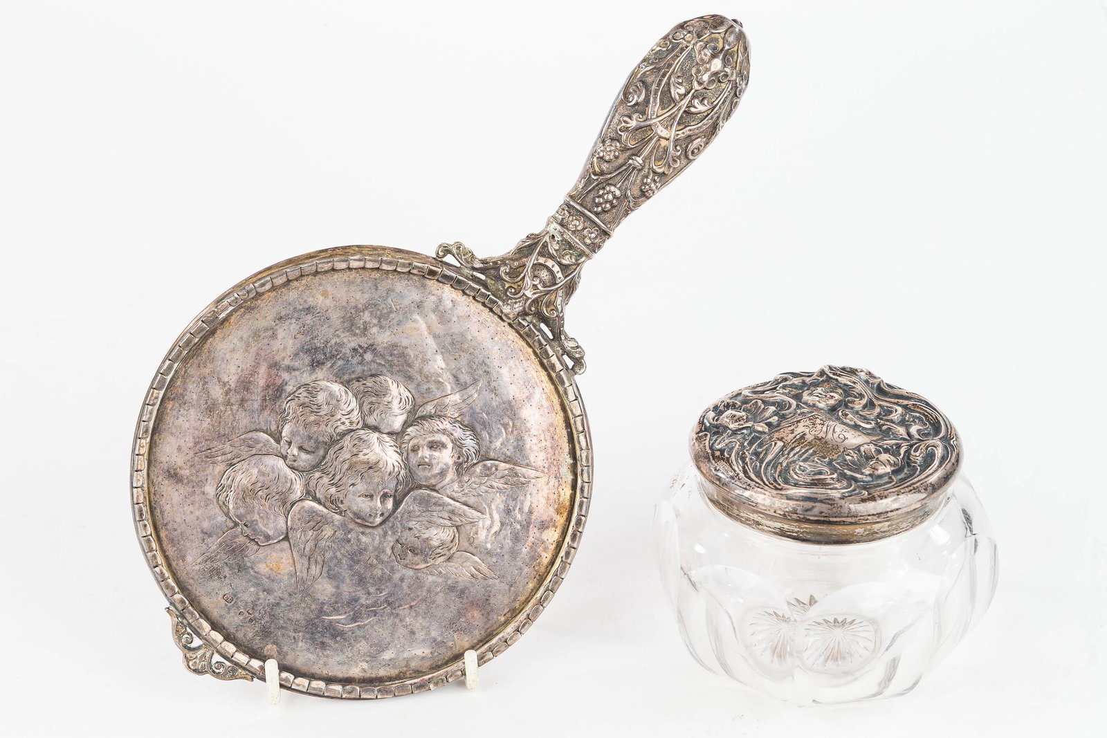 Art Nouveau and English Sterling Silver: This English, sterling silver, ornate mirror frame, circa 1870s, features cherubs marked with lion passant. There is also an art nouveau sterling powder jar lid depicting a lady with cascading hair. M