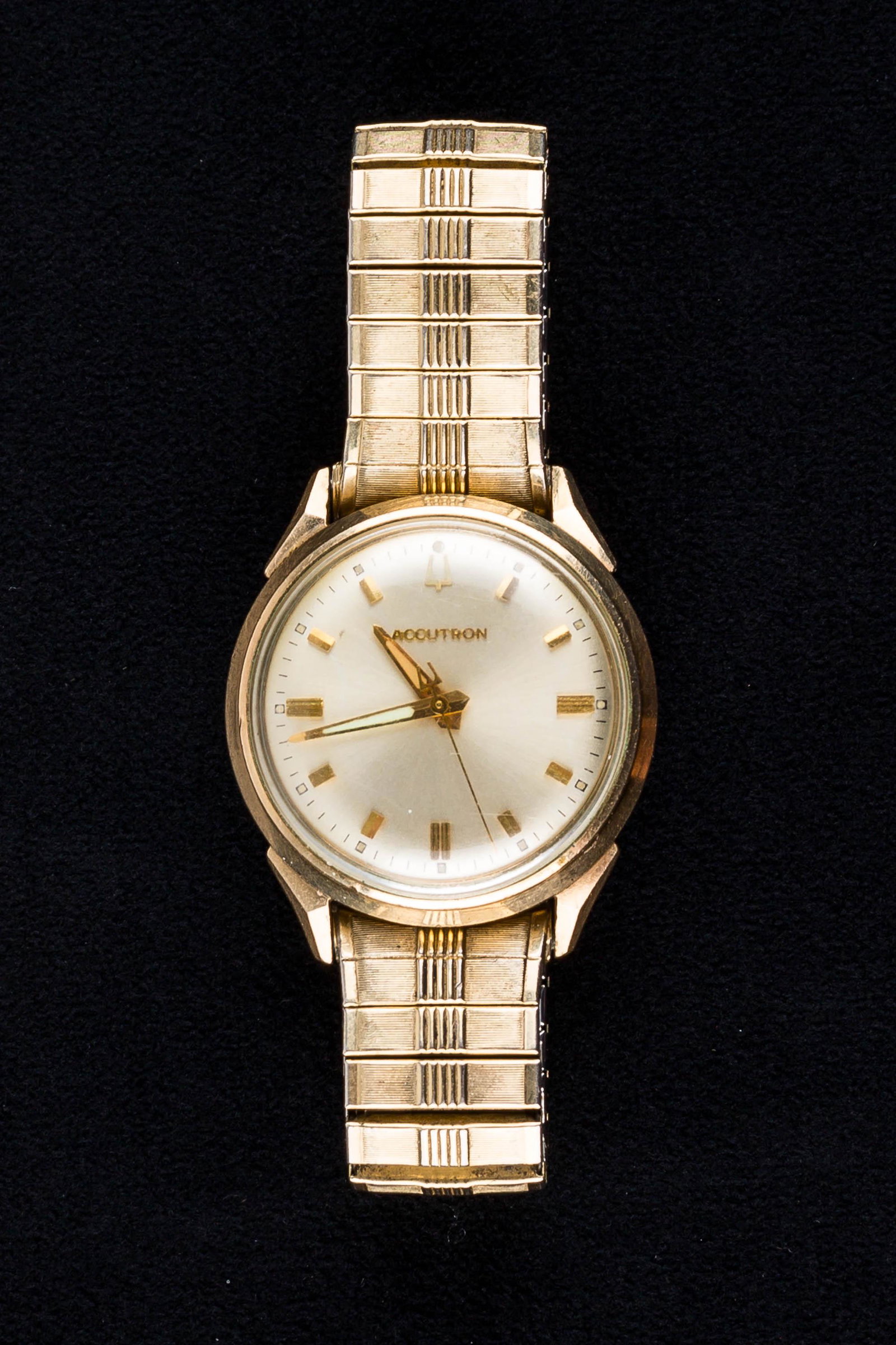 Men's Vintage Accutron Bulova Wristwatch: This Bulova Accutron men's watch has a gold fill bezel and stainless steel back dated M9; it is backwind (winds from back) and is not currently running.