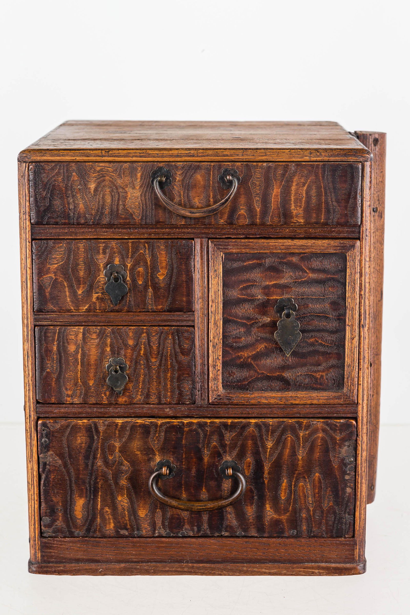 1920s Mulberry & Palomia Tansu Jewelry/Money Box: This tansu jewelry or money box has (5) drawers and a hand-dovetailed case, and it is constructed of mulberry and palomia wood. The top drawer is divided, possibly for paper bills. The bottom drawer c