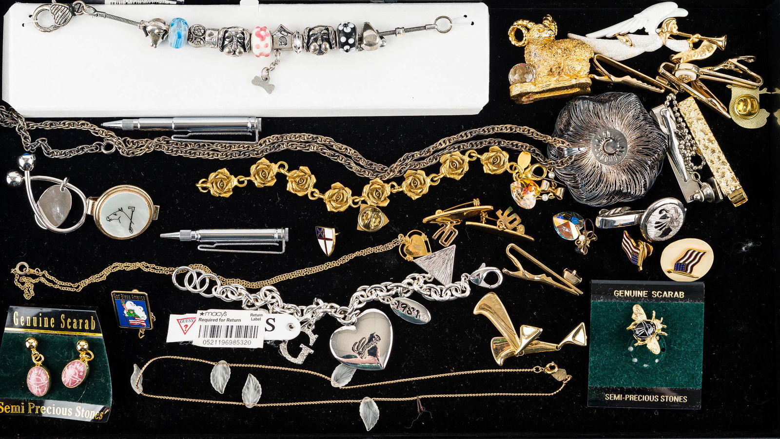 Macy's and Other Jewelry: bracelets with Macy's tags, scarab jewelry on hang cards, various tie tacks, and other jewelry.