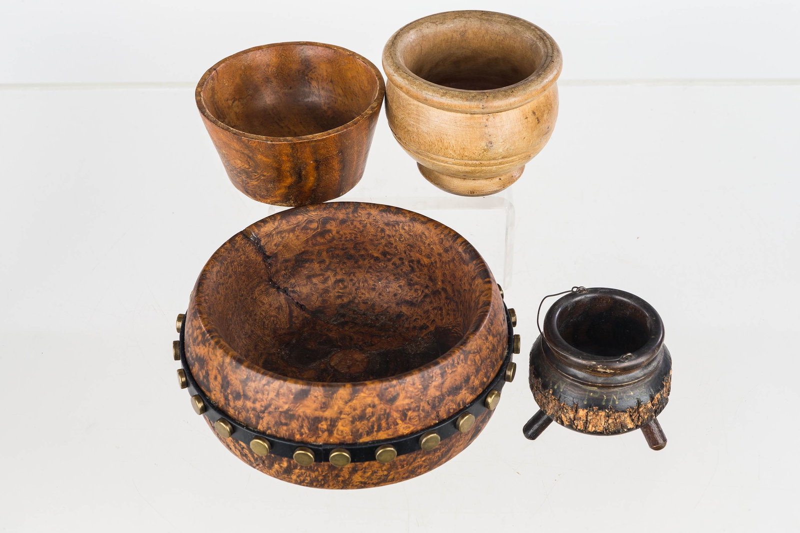 Burl and Treen Hand-Carved Pots: Including a leather wrapped burl pot measuring approx. 6.5" in diameter, (2) treen pots, and an adirondack style match safe.