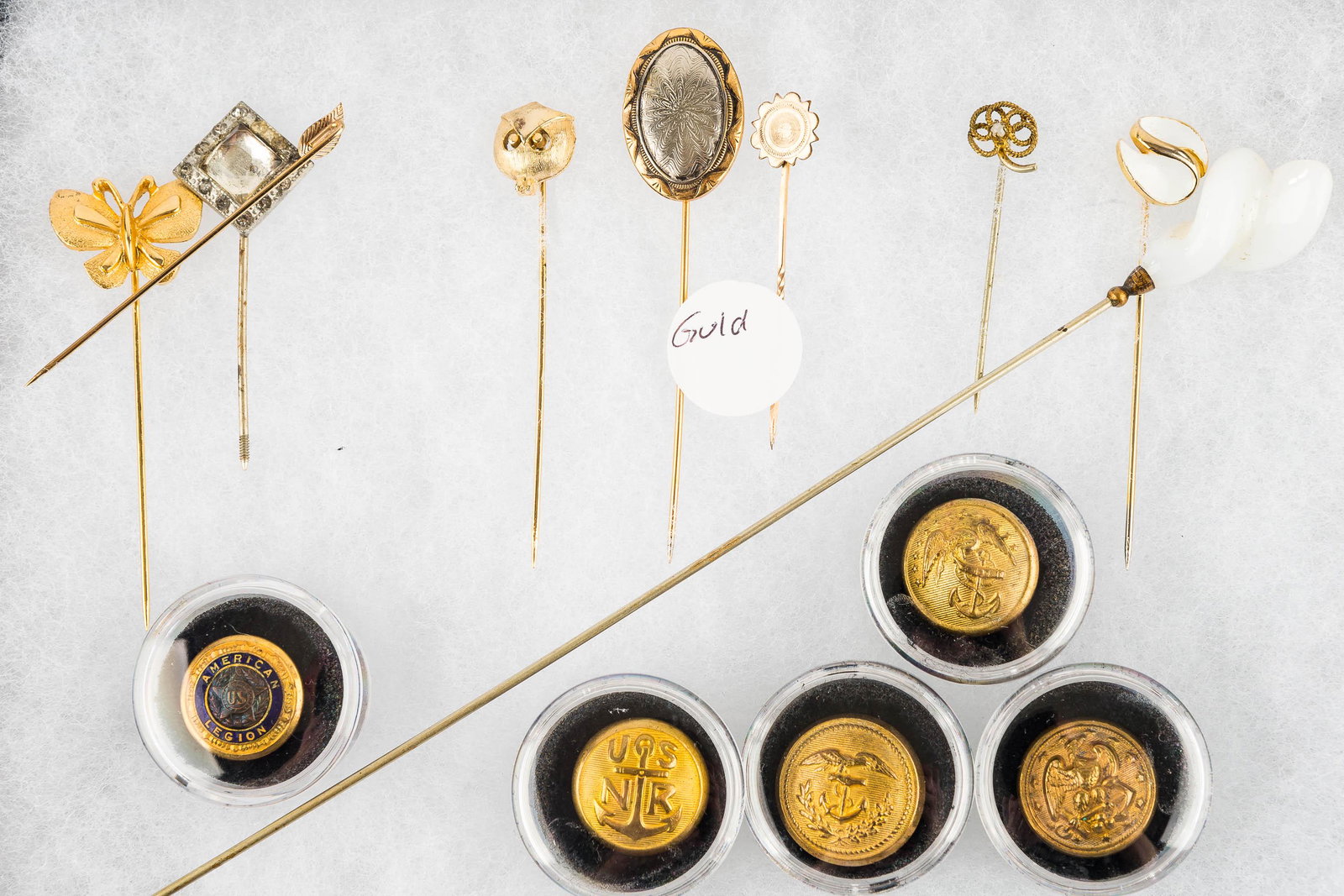 Vintage Stick Pins and Buttons: There are (9) vintage stick pins, military and other buttons; some stick pins may have gold or goldfill content.