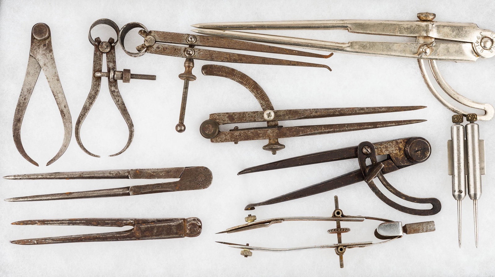 Vintage Drafting Compasses: There are (1) various vintage drafting compasses.