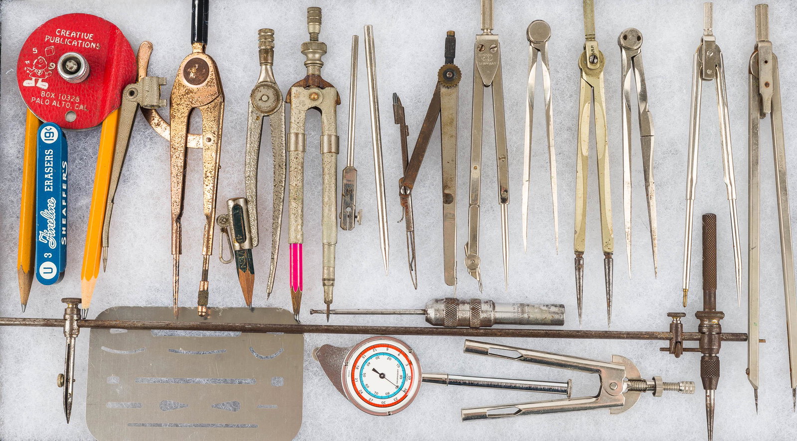 Collection of Drafting Compasses: Large selection of various drafting compasses.