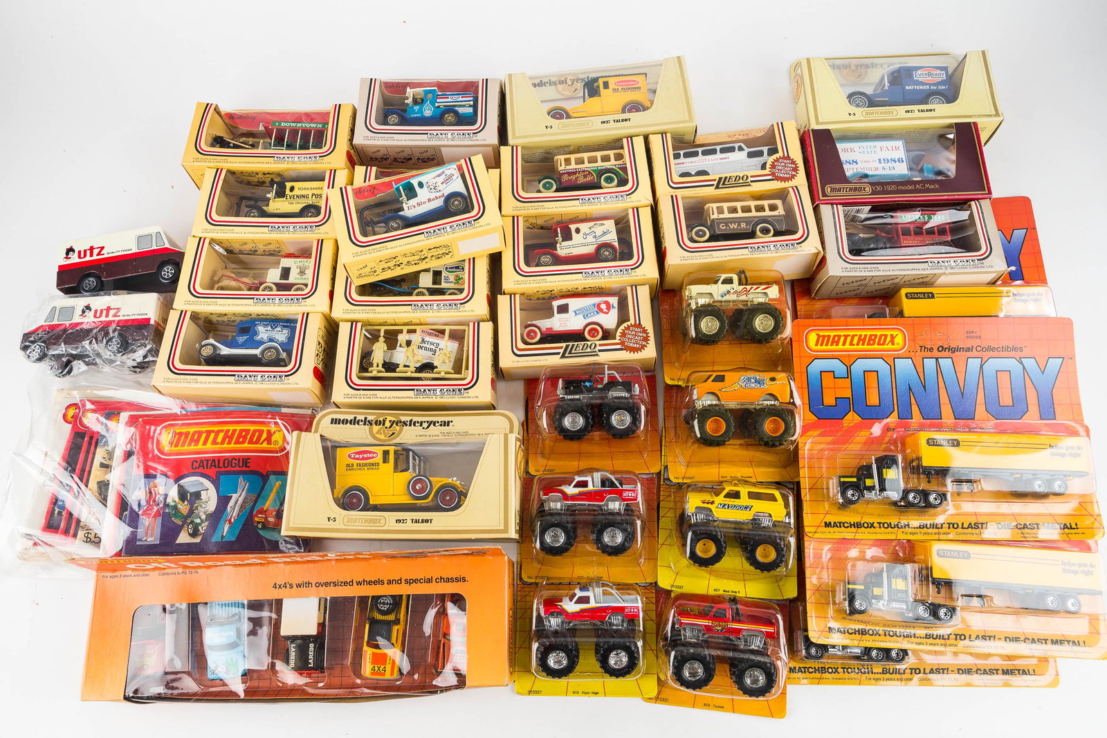 Matchbox Lledo and Other Miniature Vehicles: Including (6) Matchbox Convoy Stanley Big Rigs 1983, Matchbox Off-road Riders Set 1983, a selection of Matchbox catalogs, Lledo vehicles from England, and Matchbox models of yesteryear vehicles, most 
