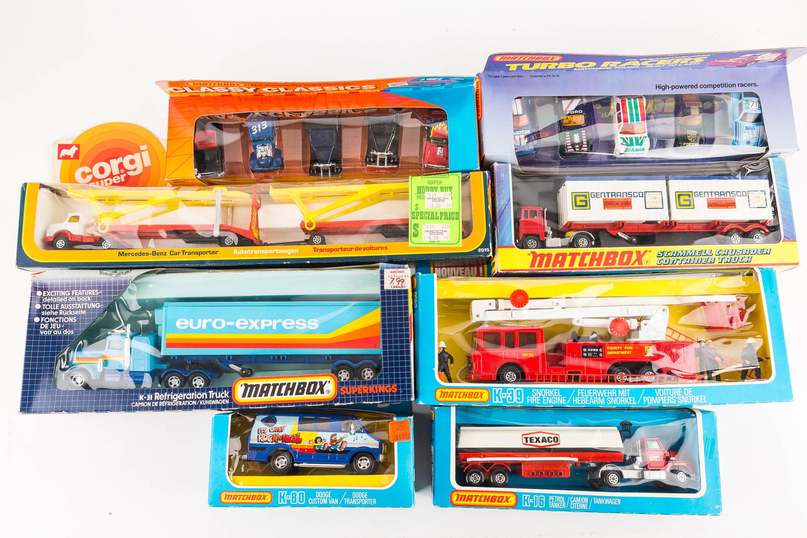 Vintage Toy Vehicles NIP: Lot consists of a Corgi transporter 1976, Matchbox Euro Express 1985, Matchbox Super King K-17, K-39 Fire truck, K-16 Texaco truck, Matchbox Classy Classics set 1985, It's Only Rock 'N Roll Van 1979,