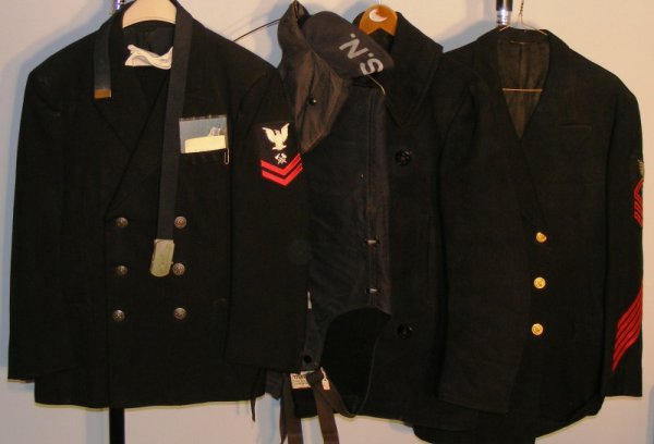 U.S. Navy Foul Weather Grouping: U.S. Navy Foul Weather grouping; 2 uniforms, 1 pea coat, 1pr foul weather pants and hat, 1 1971 pattern uniform with gloves, pants, belt, plus postcard of a ship (USS L.Y. Spear), 1 medical Chief Corp