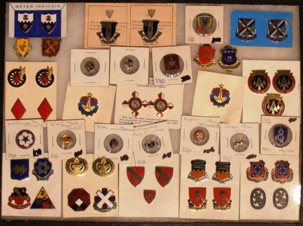 Unit Crests, Pins and Studs: Unit Crests, pins and studs of various commands including divisions and armor.