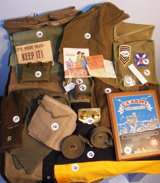 Korean War Grouping: Korean War Grouping, including a service pack, Insignia, GI Booklets, sweater hood, belts, various bags, equipment bags